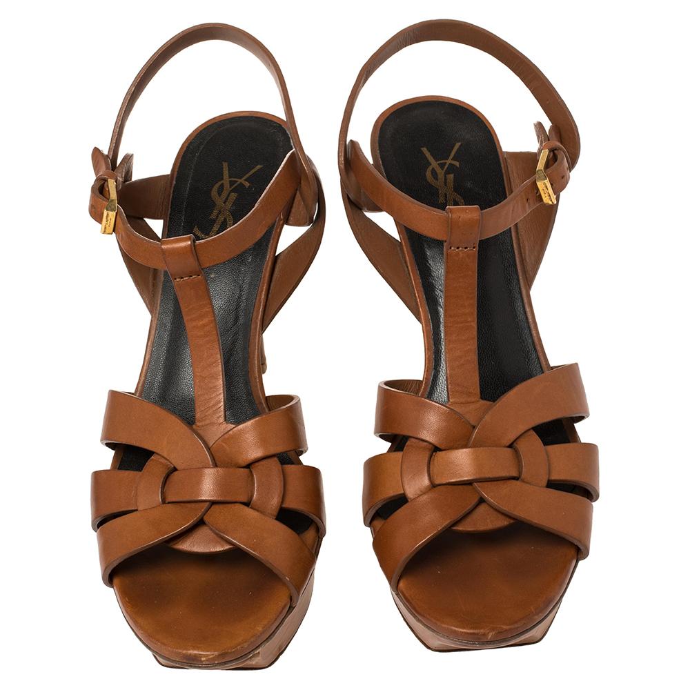 One of the most sought-after designs from Saint Laurent is their Tribute sandals. They are loved by fashionistas around the world, and it is time you own one yourself. These tan ones are designed with leather straps, ankle fastenings, and 14.5 cm