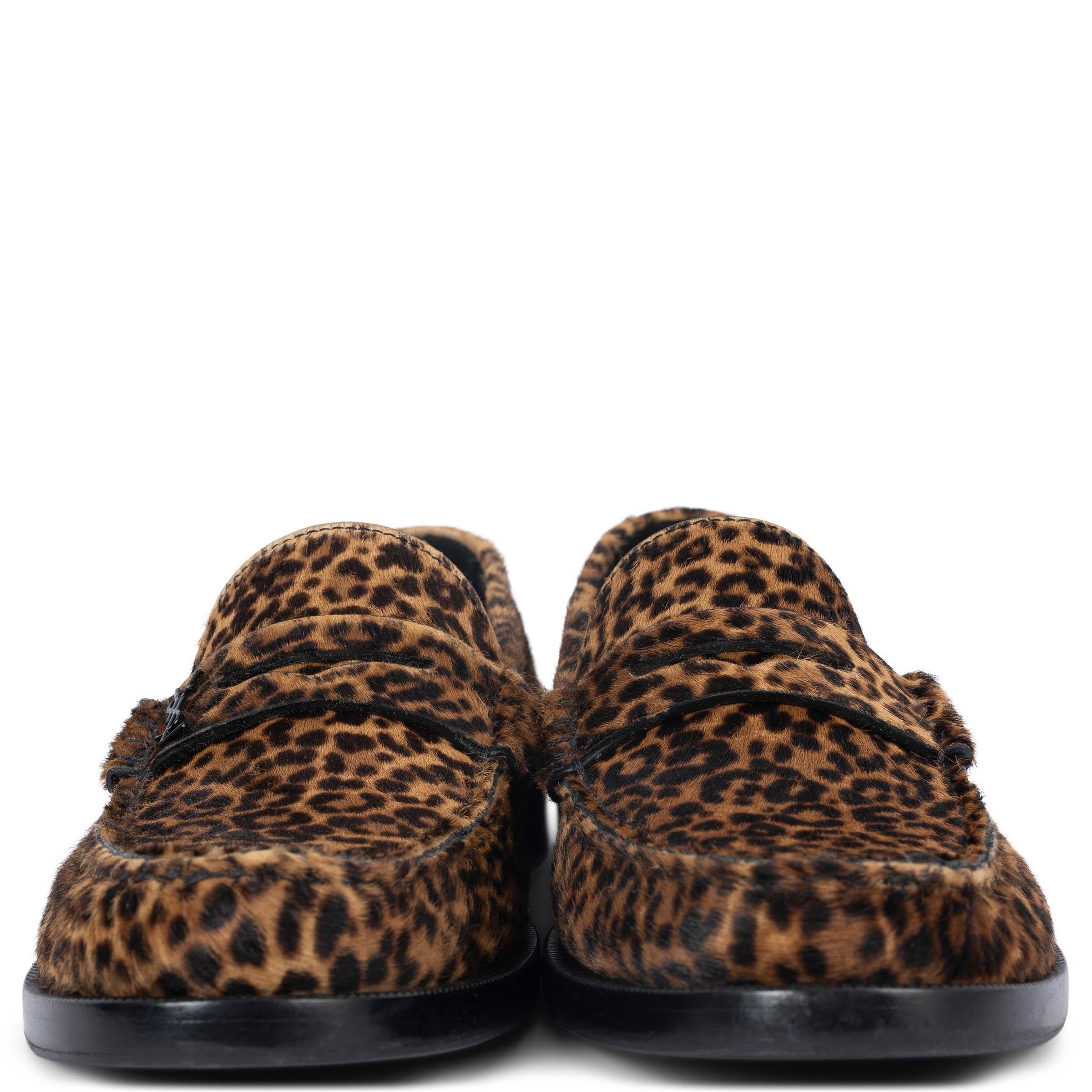 100% authentic Saint Laurent loafers in espresso brown and camel brown leopard-print calf hair. The brand's monogram is appliquéd on the apron in black metal. Have been worn and black rubber soles got added. 

Measurements
Imprinted Size	38.5
Shoe