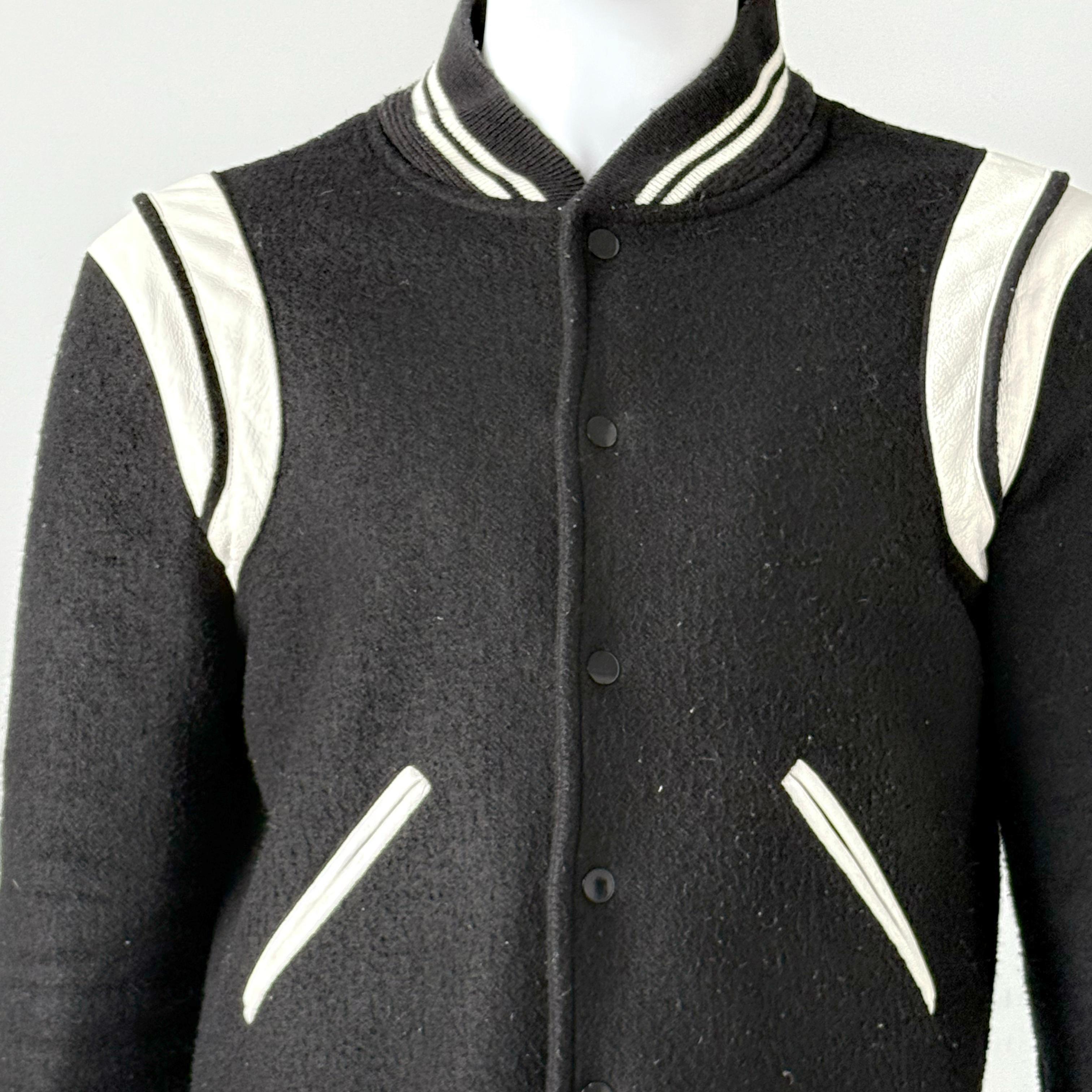Saint Laurent Wool-Blend Baseball Jacket By Anthoney Vacarello  

 Crafted from a luxurious wool blend (90% wool, 10% polyamide)

Snap-button front closure for a classic varsity look
Striped ribbed trims and elasticated cuffs for a sleek