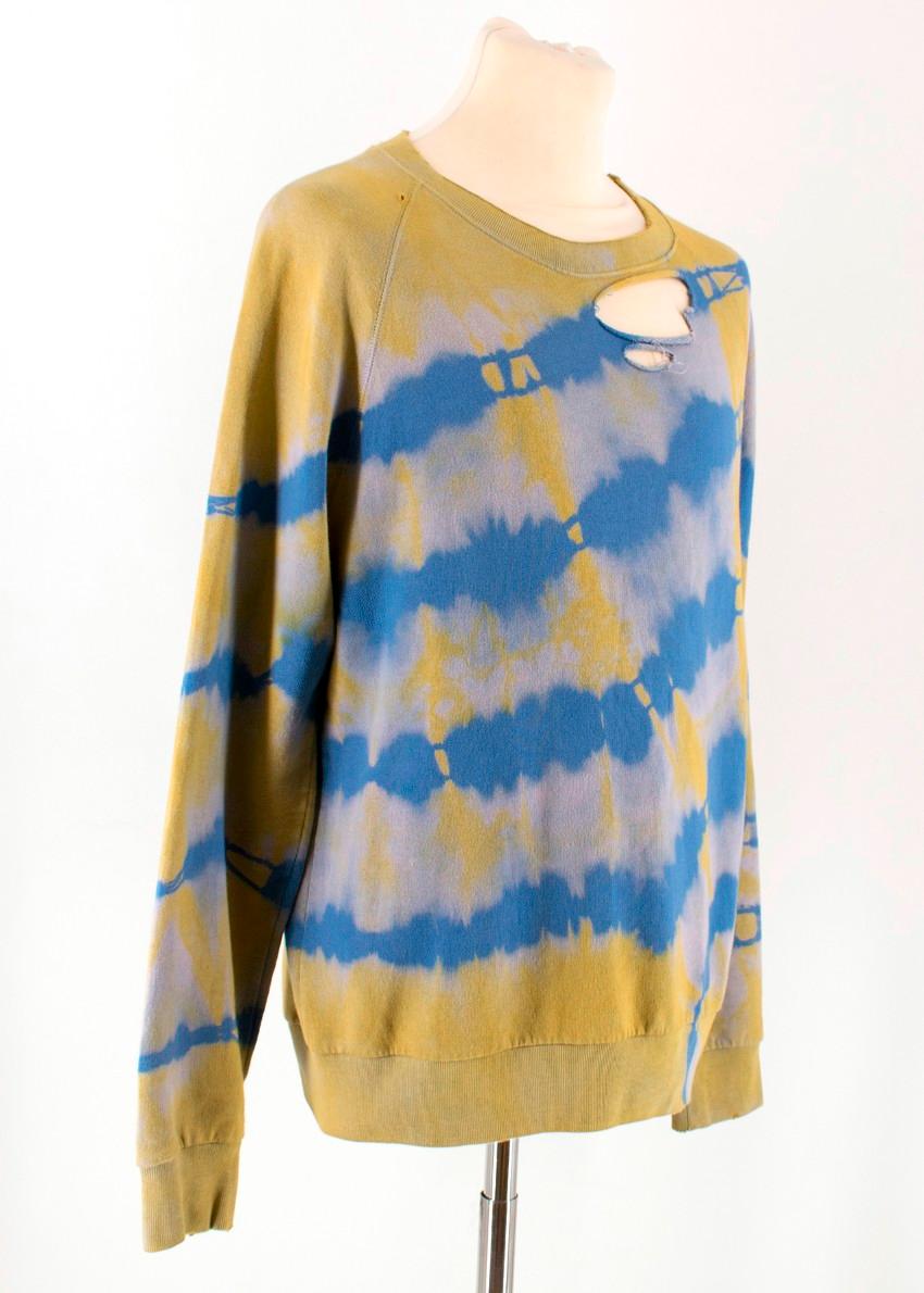 Saint Laurent Tie Die Distressed Sweater

-Blue and yellow tie die sweater
-Distressed detailing at the collar
-Ribbed cuffs, hemline and collar

Please note, these items are pre-owned and may show signs of being stored even when unworn and unused.
