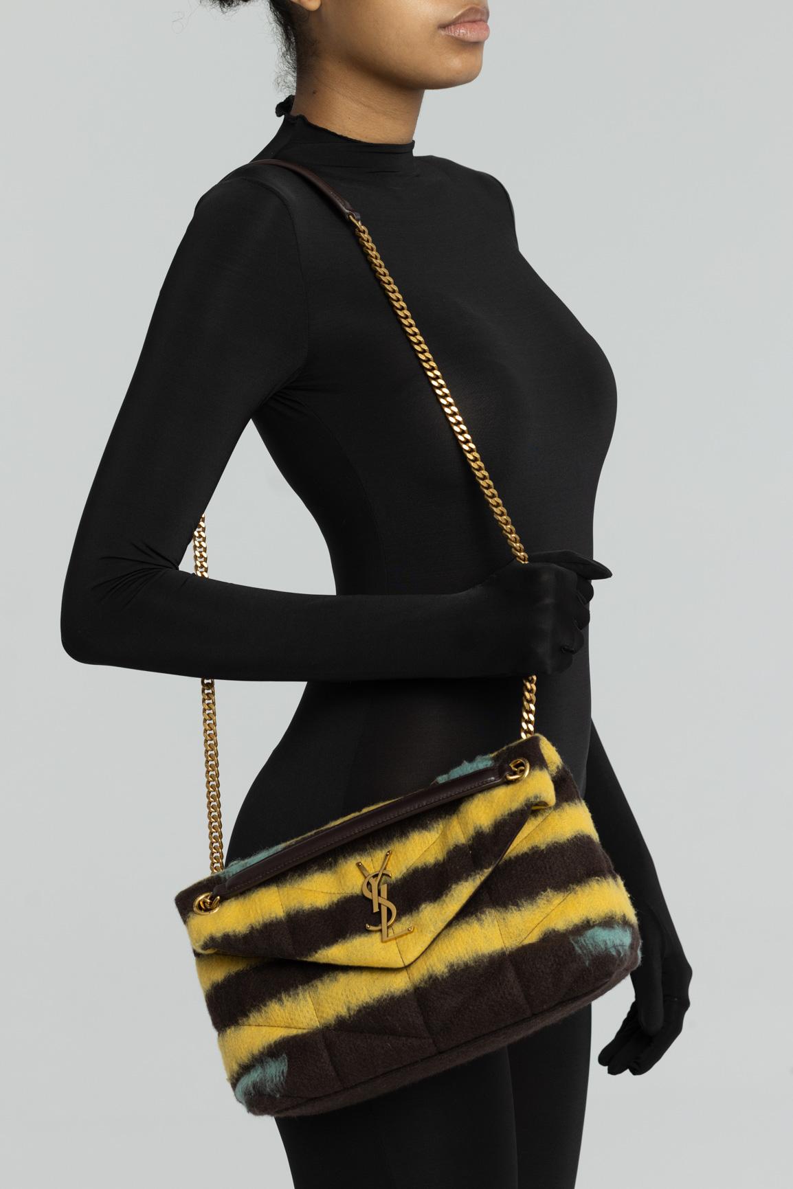Yellow black tie die ‘Puffer’ quilted shoulder bag from Saint Laurent. Size small. Monogram YSL detail at front. Made from calf wool and leather, this design features a snap fastening, metal logo appliqué, double chain strap, gold-tone metal