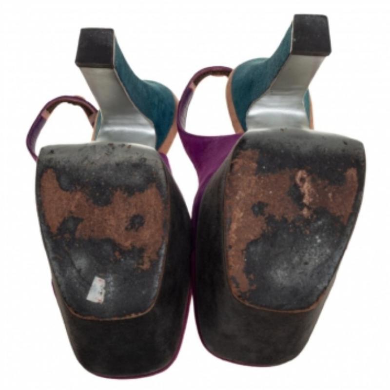 These tricolored suede sandals have a minimalist yet chic design that blends effortlessly with any outfit. They come with slingbacks and high heels. These square-toe sandals from the house of Saint Laurent will add an understated elegance to your