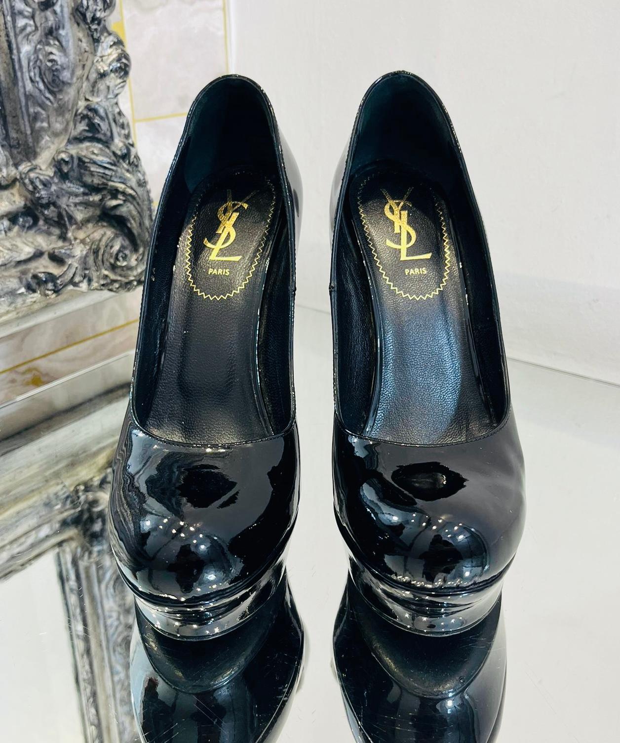 Saint Laurent Tribtoo Patent Leather Pumps

Glossy black heels designed with almond toe and high platform.

Featuring thick stiletto heel and leather lining and insoles.

Size – 38

Condition – Very Good

Composition – Patent Leather

Comes with –
