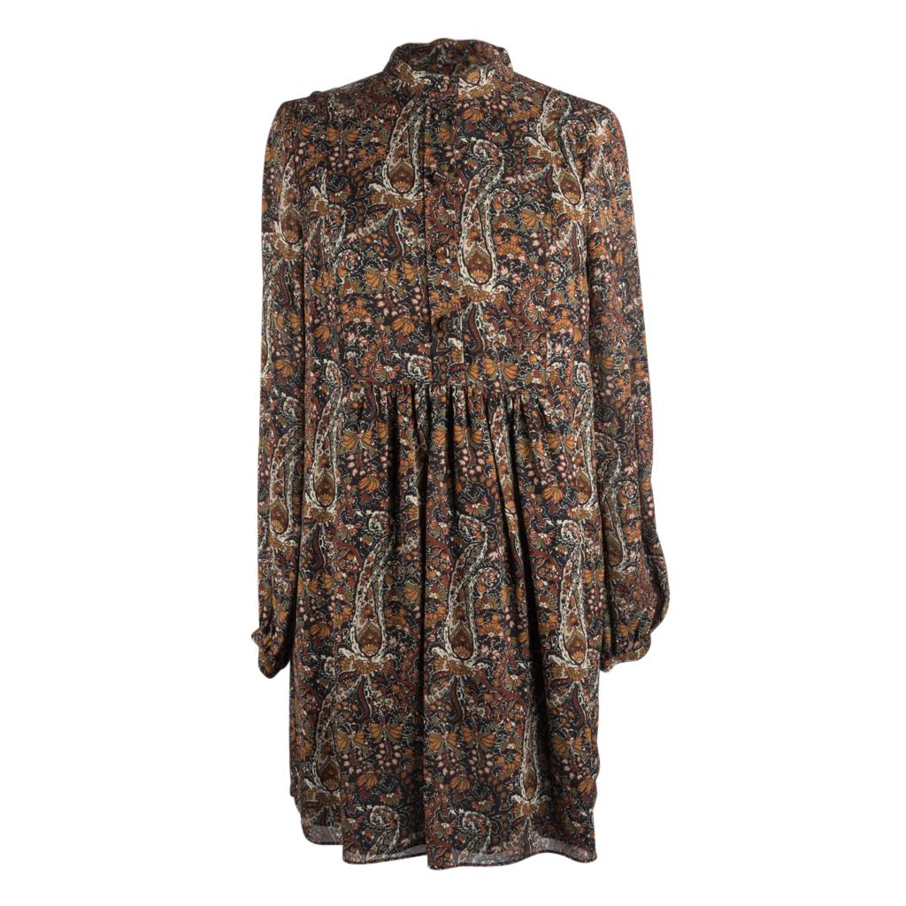 Mightychic offers a Saint Laurent paisley tunic/dress in warm earth tones.
Abstract floral print with paisley details.
Gently gathered under bust with long softly gathered sleeves.
5 covered buttons in front and 1 on each cuff.  
Mandarin