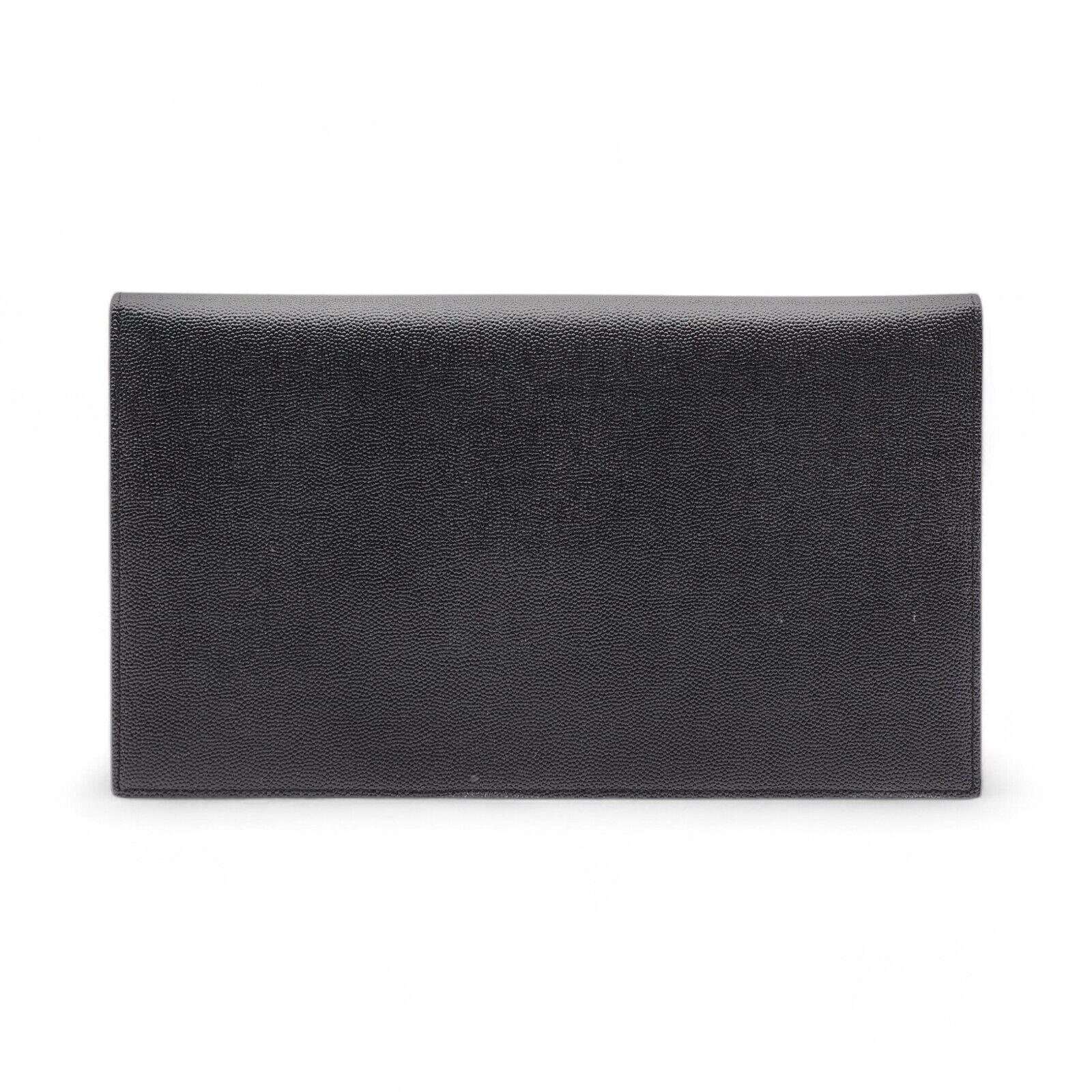 Saint Laurent Uptown Pouch Clutch Bag. Signature Saint Laurent Grain de Poudre. Gold YSL logo.

Additional information:
Material: Leather
Color: Black
Country: Italy
Dimension: 10.5 x 6.25 (inches), 27 x 16 (cm)
Condition: Brand new with minor