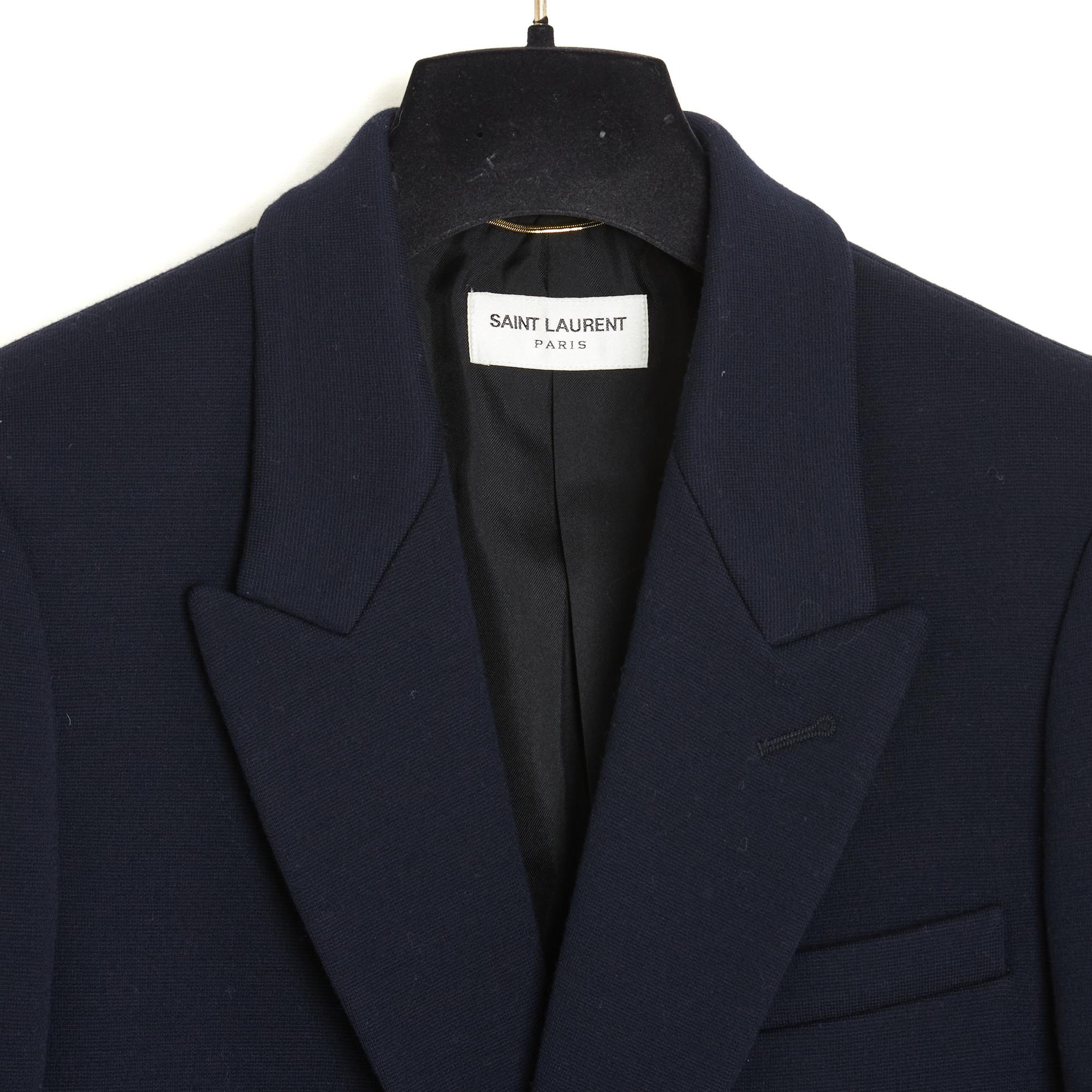 Saint Laurent Pre Fall 2016 collection jacket by Hedi Slimane, blazer in thick dark navy wool jersey, fitted cut, notched collar closed by 2 large marine-inspired buttons in gold metal, 1 patch pocket on the chest, 2 flap pockets, slit at the back,