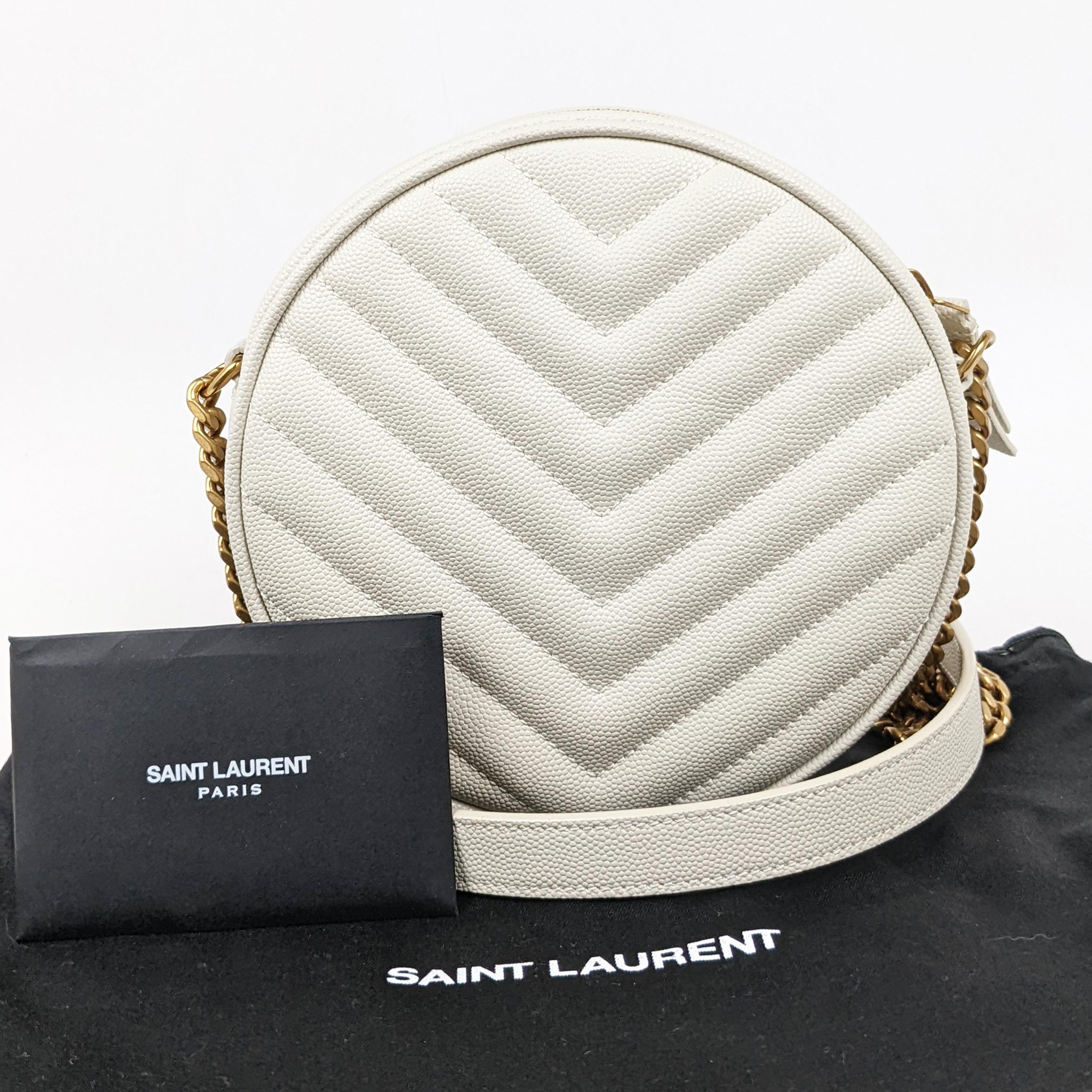 Condition: This authentic Saint Laurent round bag is in excellent pre-loved condition. There are light scratches to the hardware.

Est. Retail: $1500

Includes: Dust bag, cards

Features: Gold hardware, chain strap with leather pad, interior slip