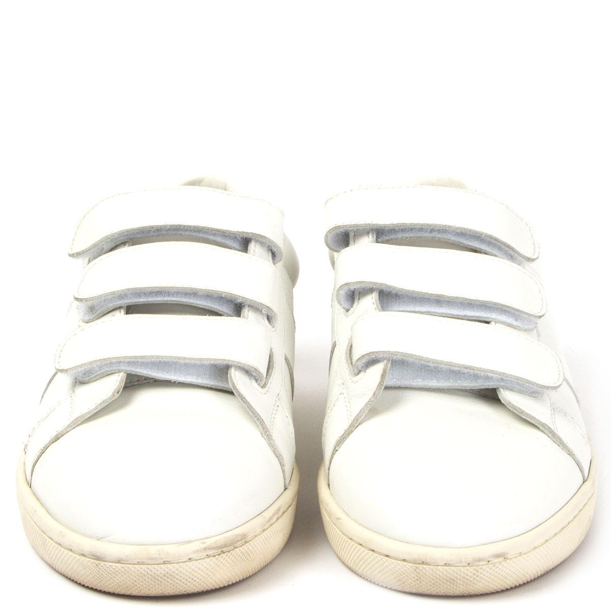 100% authentic Saint Laurent low-top 'Court Classic' sneakers in white calfskin with three velcro fasteners. Contrasting rear tab embossed with gold-tone Saint Laurent. Have been worn and are in excellent condition. Come with dust bag.