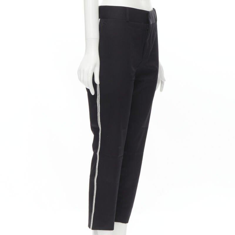 SAINT LAURENT white side braided trimming formal trousers S
Reference: MELK/A00071
Brand: Saint Laurent
Designer: Hedi Slimane
Color: Black, White
Pattern: Solid
Closure: Zip
Extra Details: Belt loop d on waist. White braided trimming along sides.