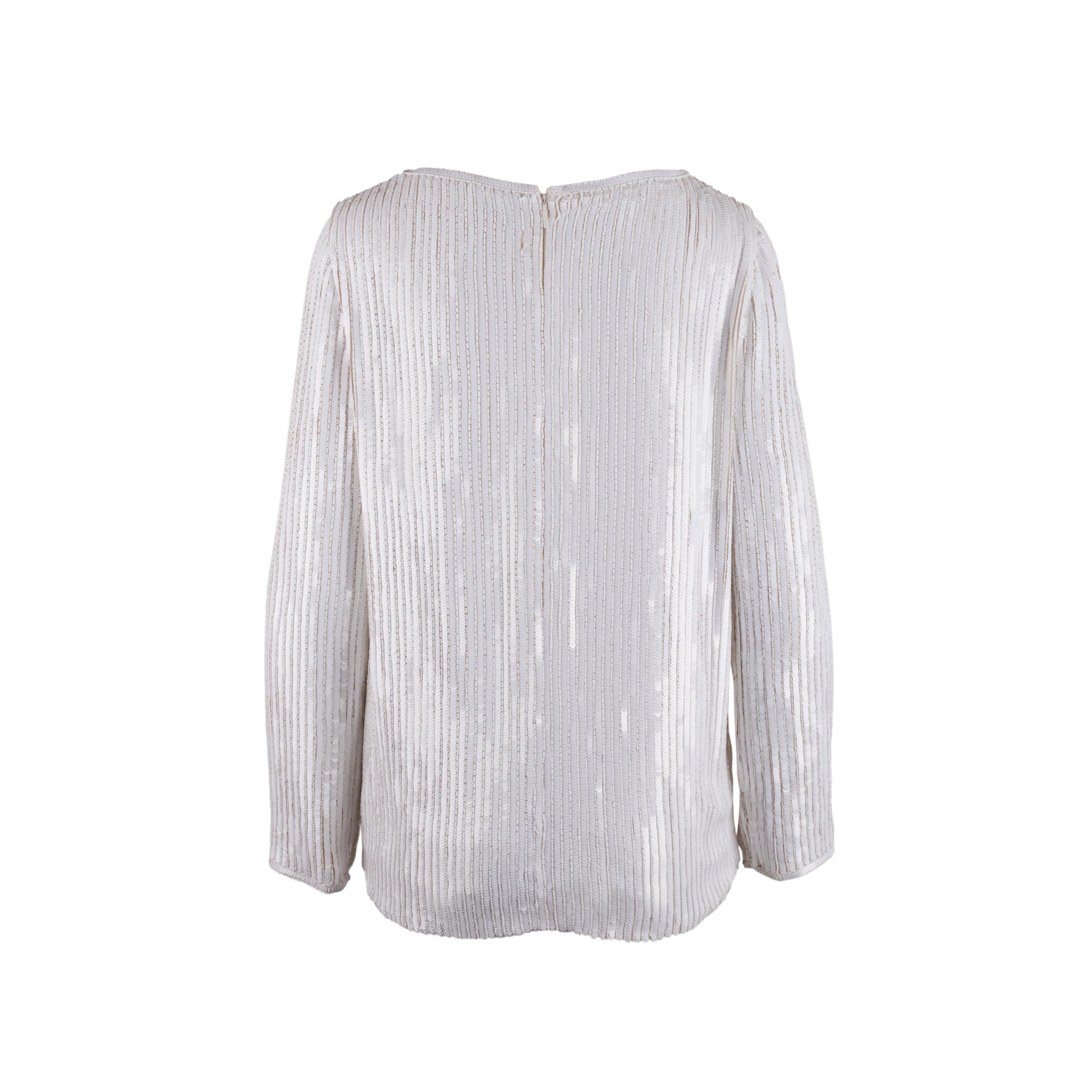 Saint Laurent white silk blouse, long sleeves, crew neck, back zip, decorated with white sequins for full coverage.