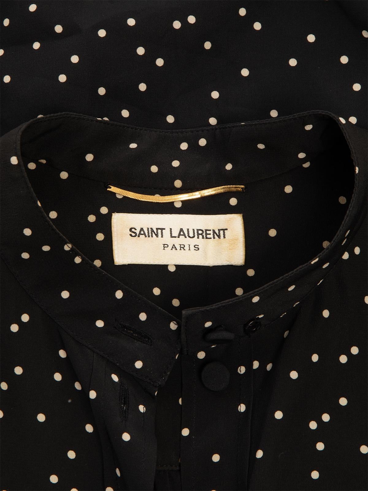 CONDITION is Very good. Minimal wear and pilling to fabric is evident. One stain evidenton this used Saint Laurent designer resale item.  Details  Black Silk Shirt dress with polka dots Loose fit  Long sleeves High collar and buttoned down front 