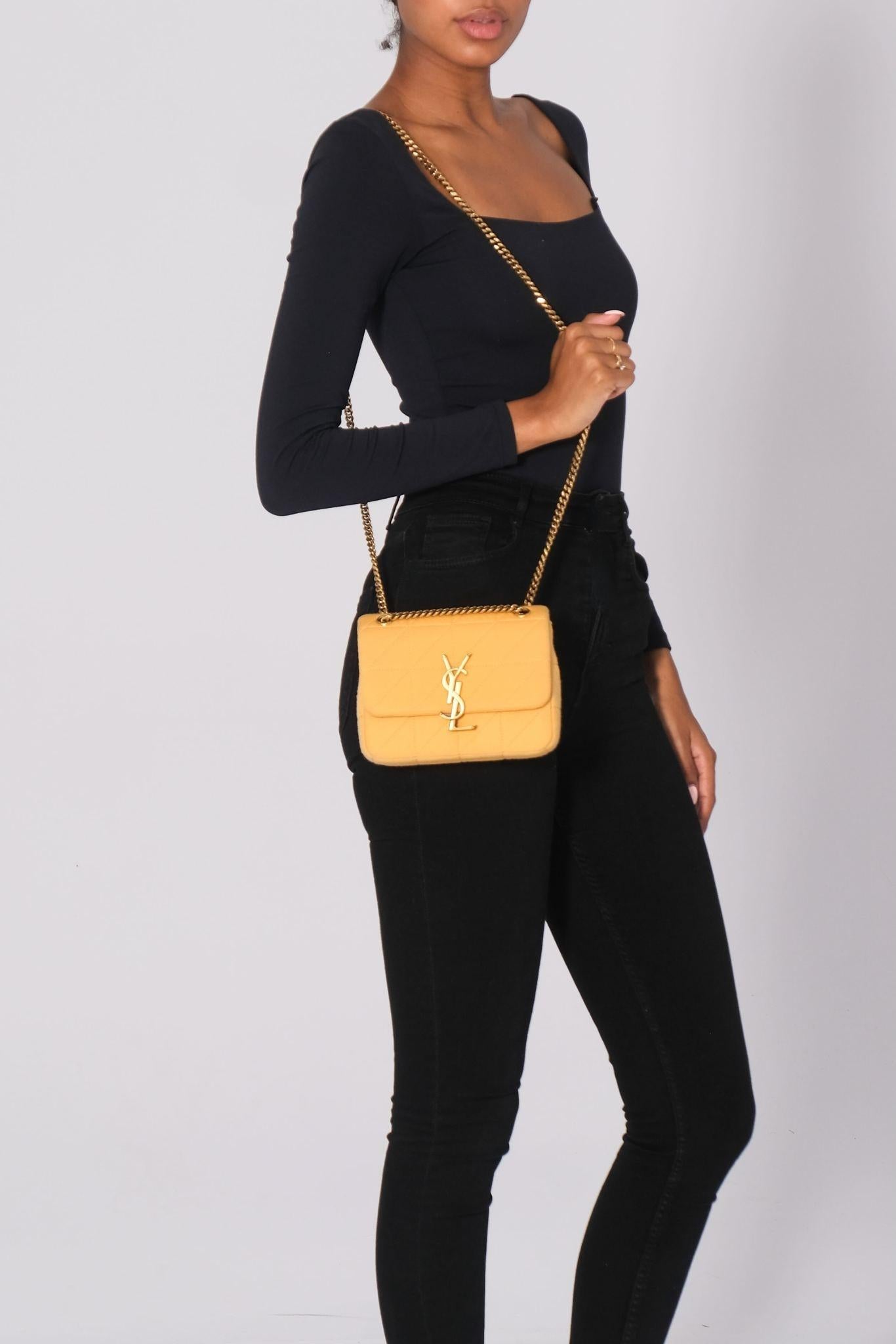 Retail.
Color: yellow
Material: jersey
Model No. 698162
Comes with: dust bag and tag
Condition: Excellent/very good. Like new bag. Faint marks.
Made in Italy

Measurements~
Height 6”
Width 7”
Depth 2”
Drop 20”