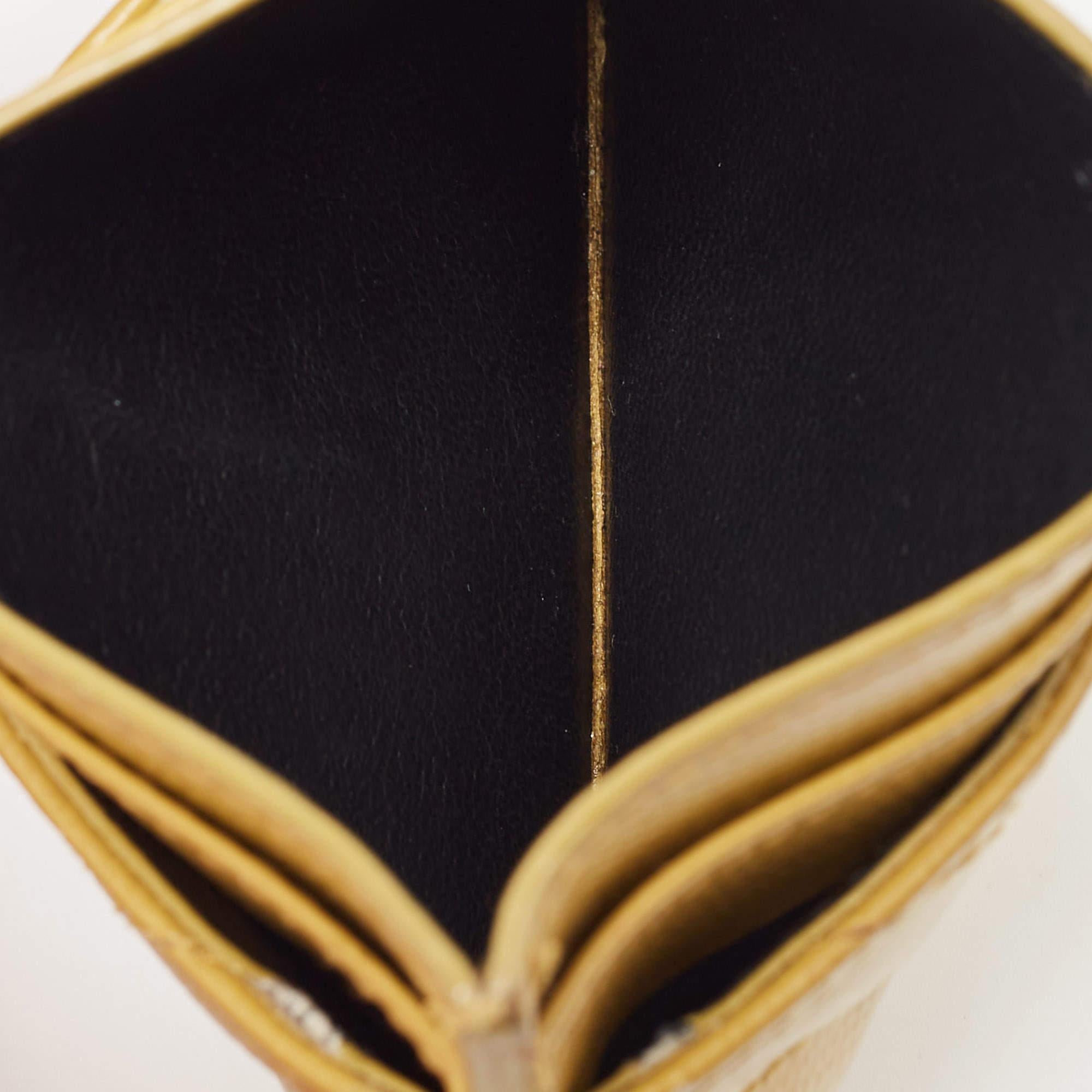 Exquisitely rendered from yellow leather this Saint Laurent card holder embodies a contemporary shape. Named after Adolphe Mouron Cassandre this Cassandre card holder will incorporate a touch of luxury into your outfit. The brand detailing on the