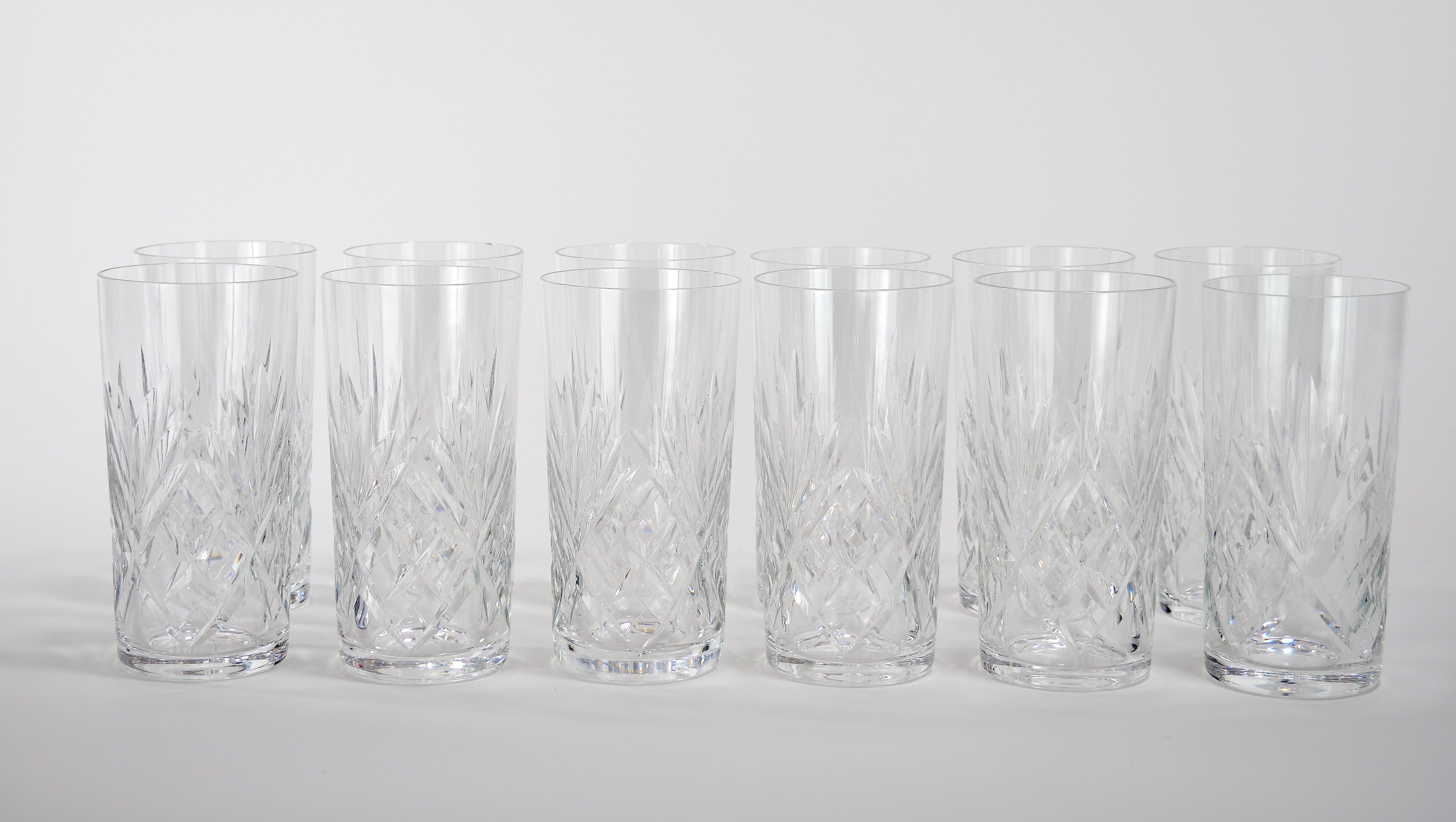 Richly hand cut and mouth blown barware and tableware glassware service for 12 people. Each glass features a deep cuts that allow the light to retract and shine to a brilliant finish from any angle. Mouth blown and hand cut by France's oldest