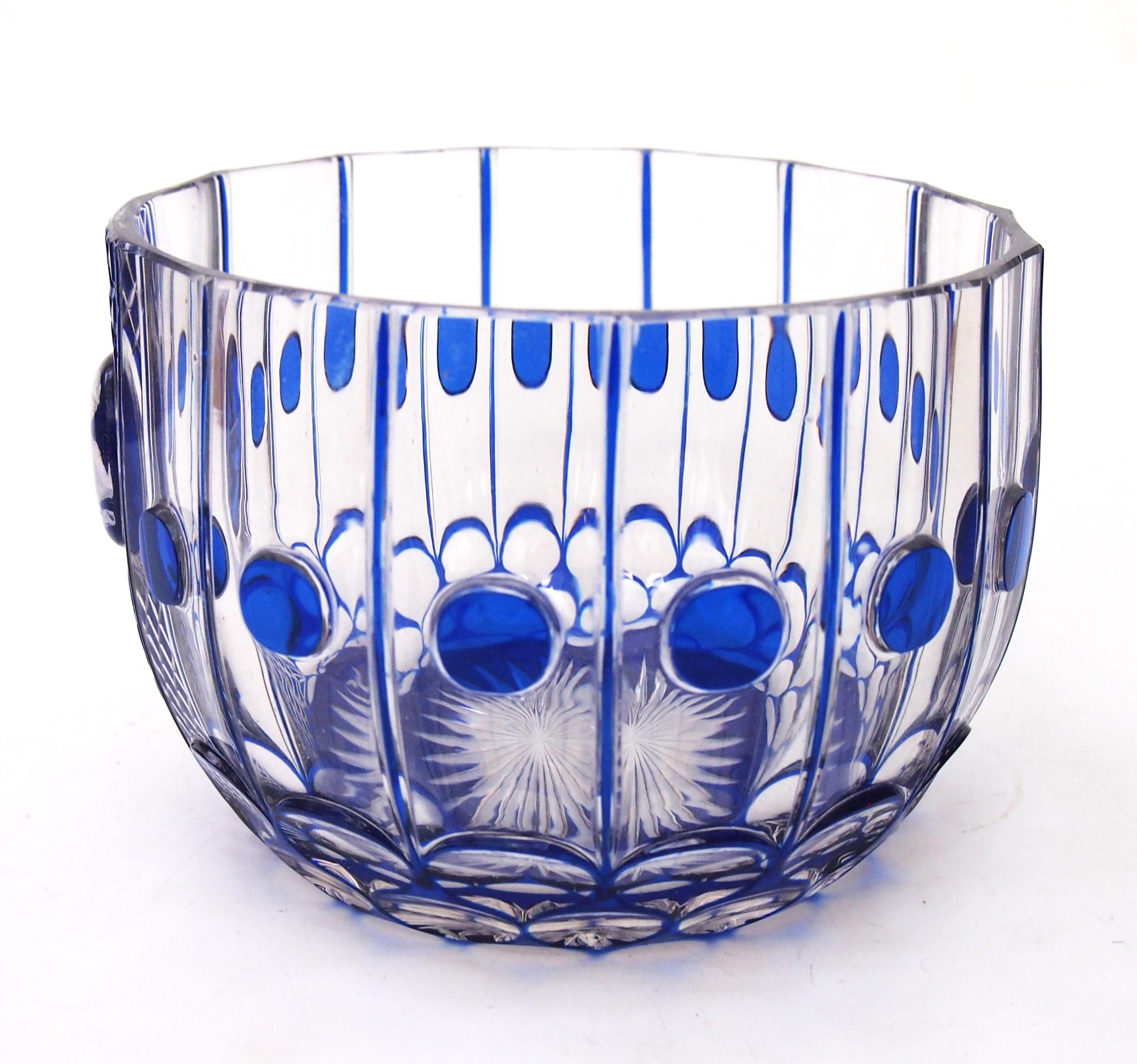 An exceptional intricately, cut to clear, bowl by Saint Louis - Rarely this bowl has a sulphide to the front depicting a courtier. The bowl is cases in blue and finely cut to clear to generate a pattern of lines and small roundels. The lower parts