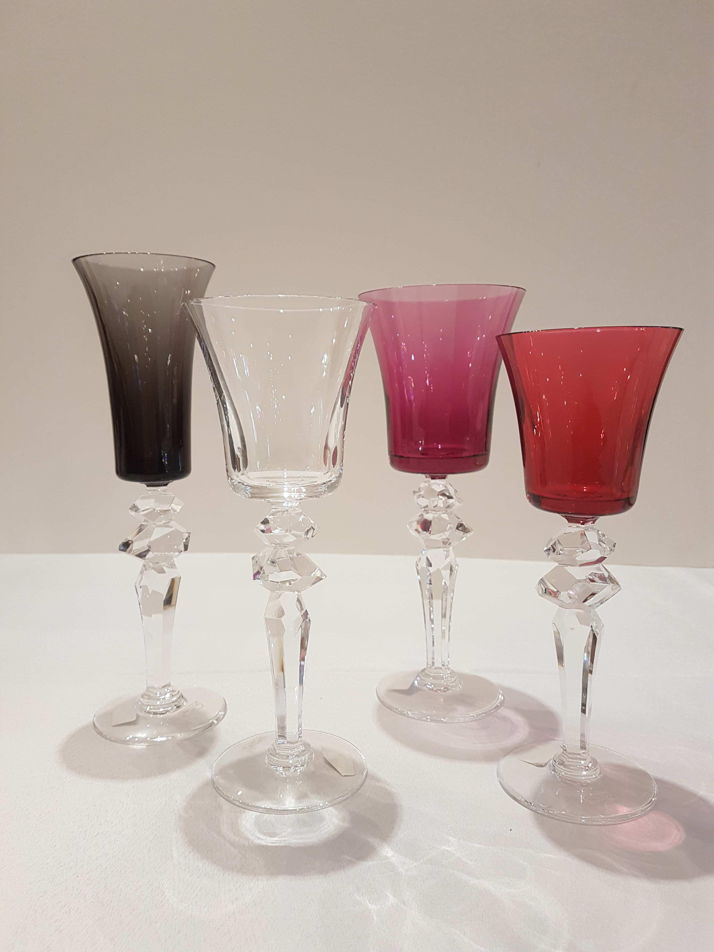 This gorgeous set of four different sizes of this ultra fine crystal stemware is for two. Comprising : 2 flannel-grey champagne flutes, 2 amethys american water glass, 2 water glass, 2 red wine glass ( the protuction of red colour wine glass are now