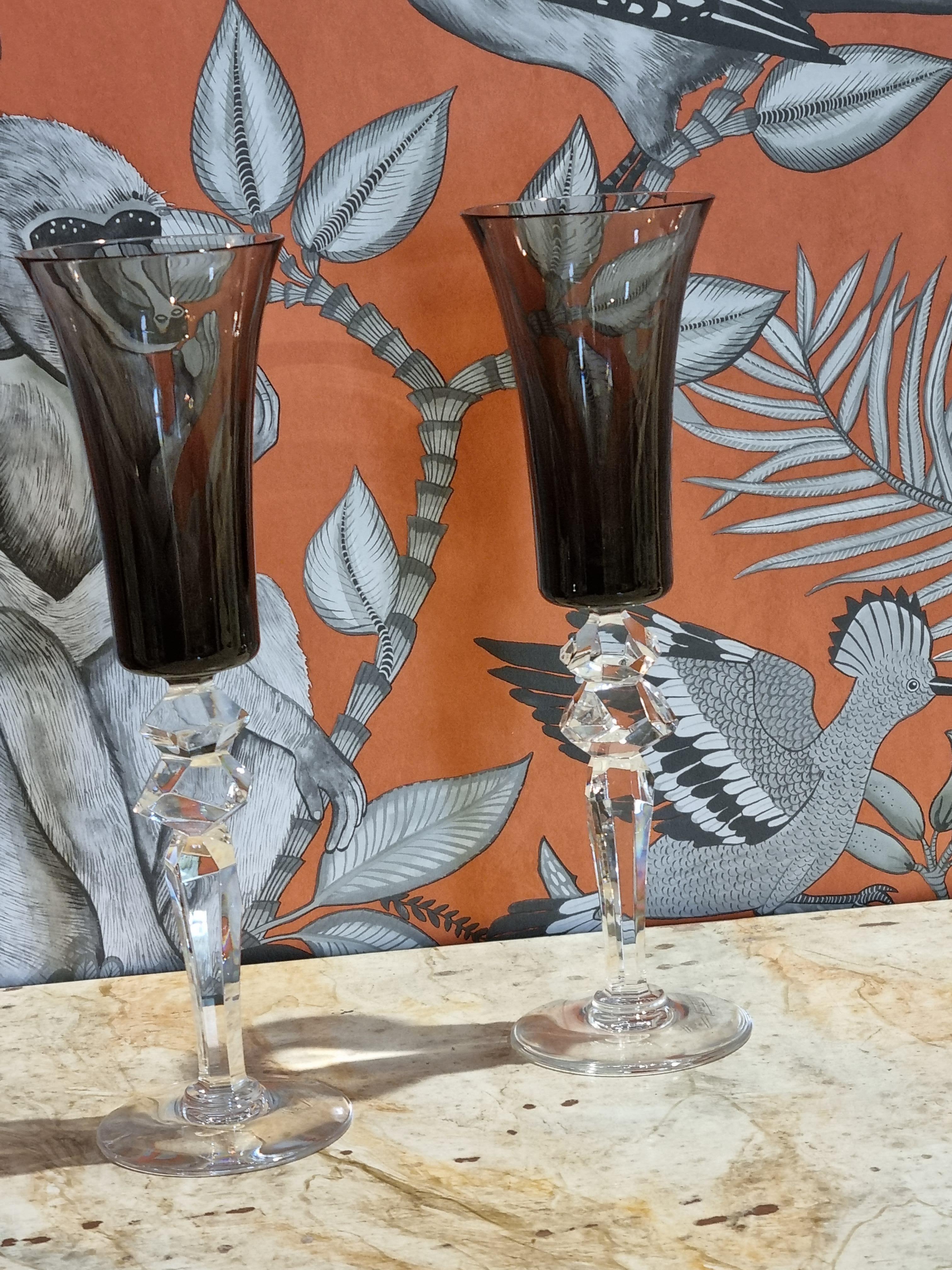 This gorgeous set of four different sizes of this ultra fine crystal stemware is for two. Comprising : 2 flannel-grey champagne flutes, 2 amethys american water glass, 2 water glass, 2 red wine glass ( the protuction of red colour wine glass are now