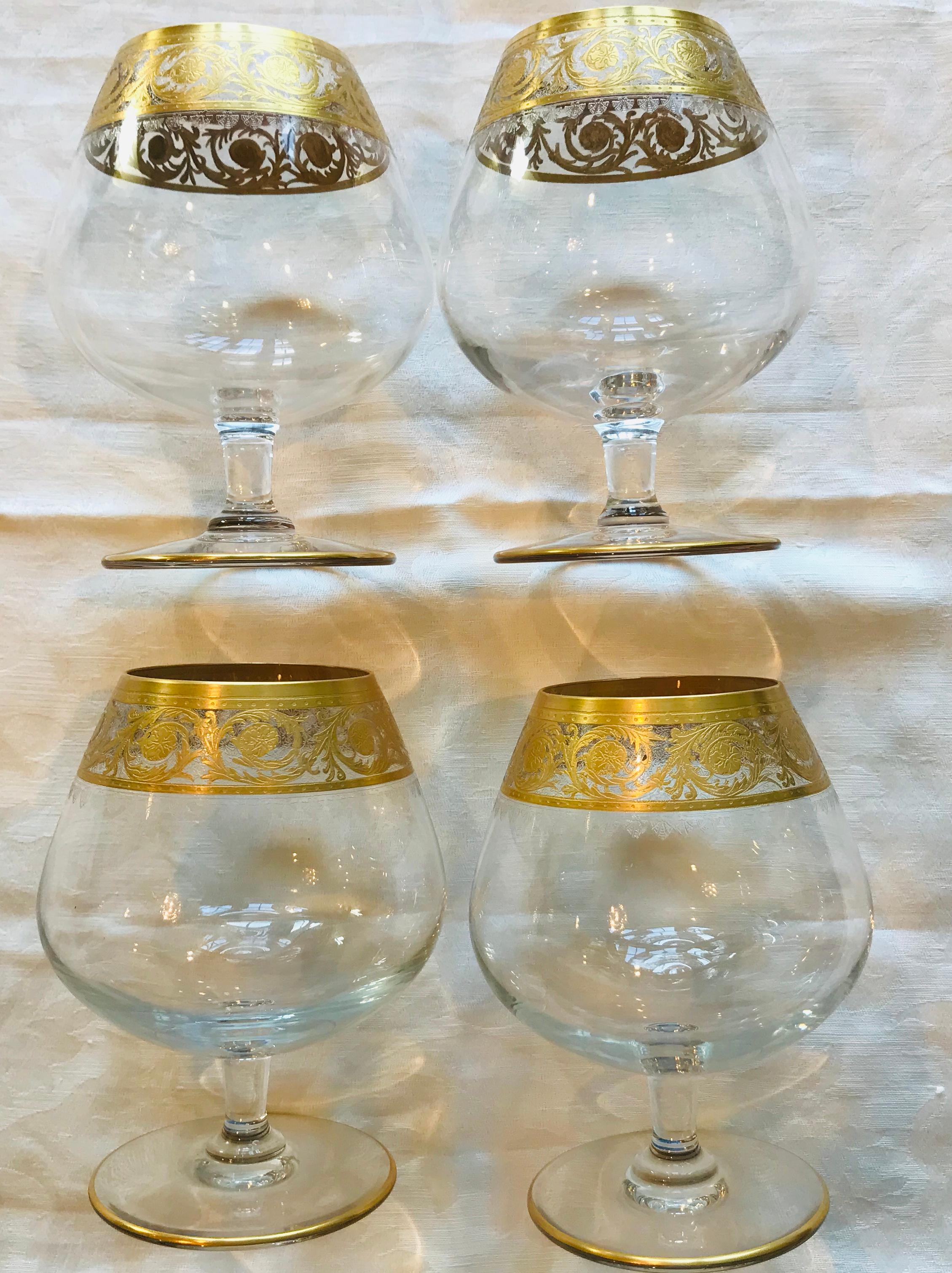 Four gold encrusted snifters from the Saint Louis Gold Thistle collection. 

This pattern is still in production in France, making this set of snifters, produced between 1986 and 1995, a nice addition to your collection (or the starting point for