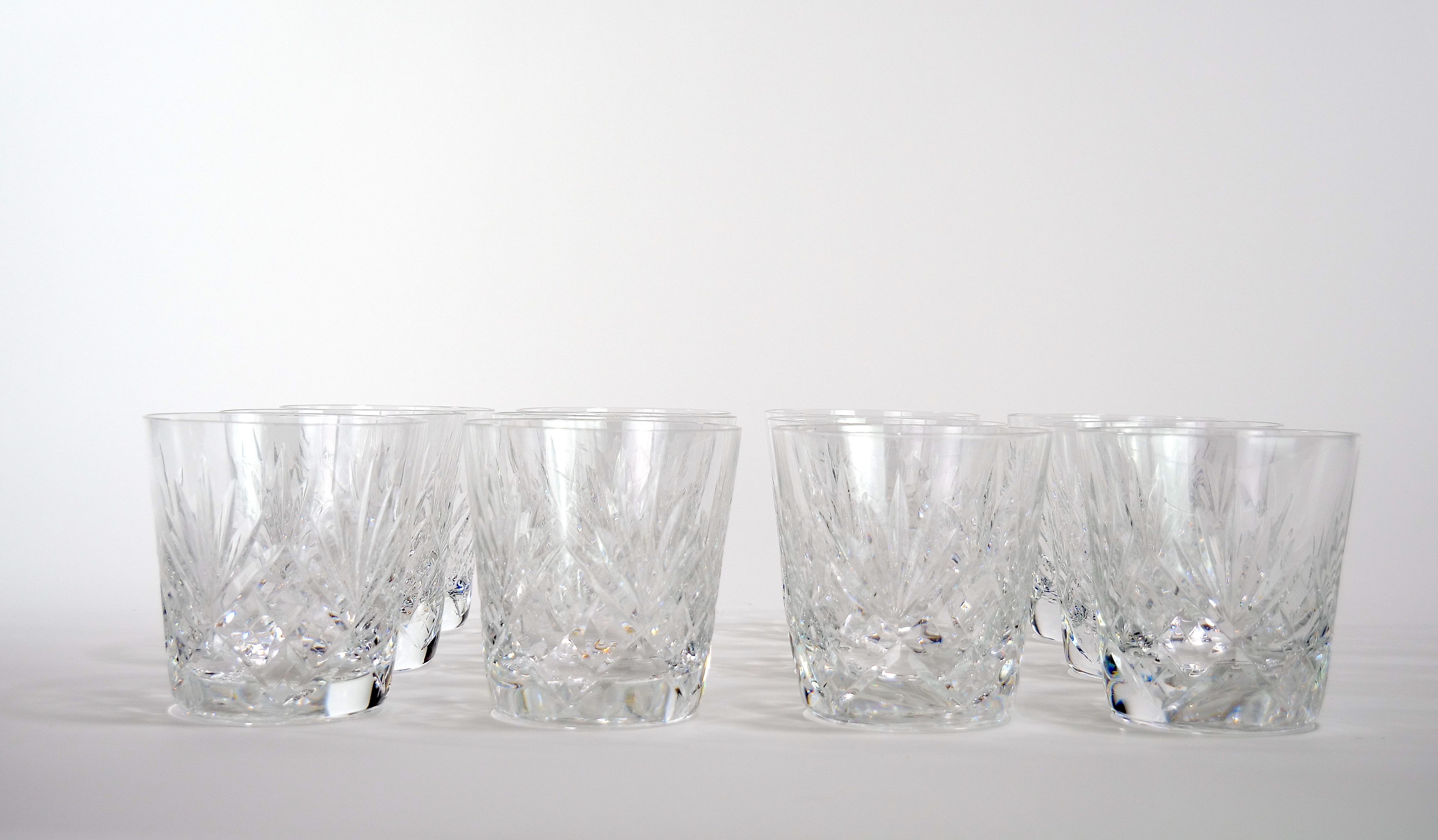Richly hand cut and mouth blown regular old fashioned barware and tableware glassware service for 12 people. Each glass features a deep cuts that allow the light to retract and shine to a brilliant finish from any angle. Mouth blown and hand cut by