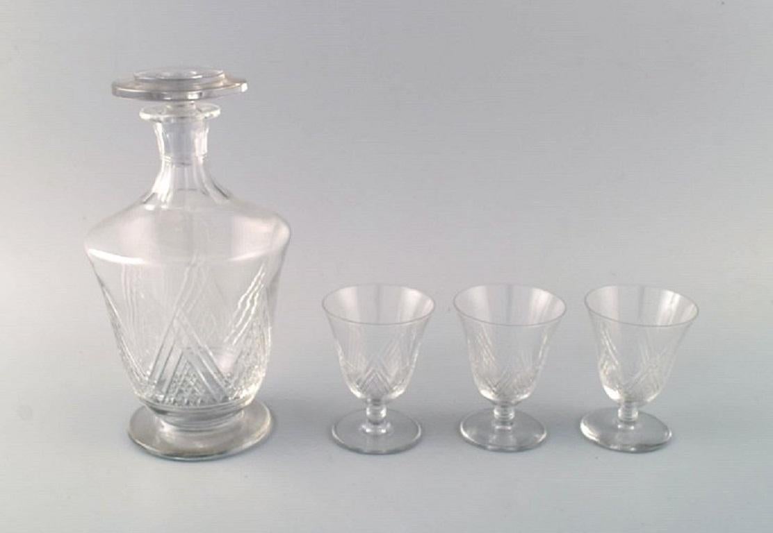 Saint-Louis, France. Sherry set in clear mouth-blown crystal glass. 
Consisting of three sherry glasses and a carafe. 1930s.
The carafe measures: 22 x 11.5 cm.
Sherry glass measures: 8.5 x 6.5 cm.
In excellent condition.
Stamped.