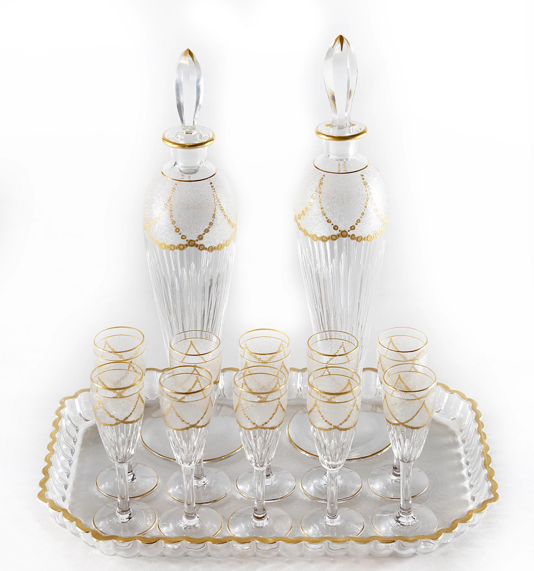 Antique French Saint Louis cut and frosted crystal liqueur set finely decorated with gilded ornaments, that includes 8 pieces of goblets, 2 pieces of decanters and 1 piece of tray.
Model 283, described in the catalogue from 1930.
Very good antique