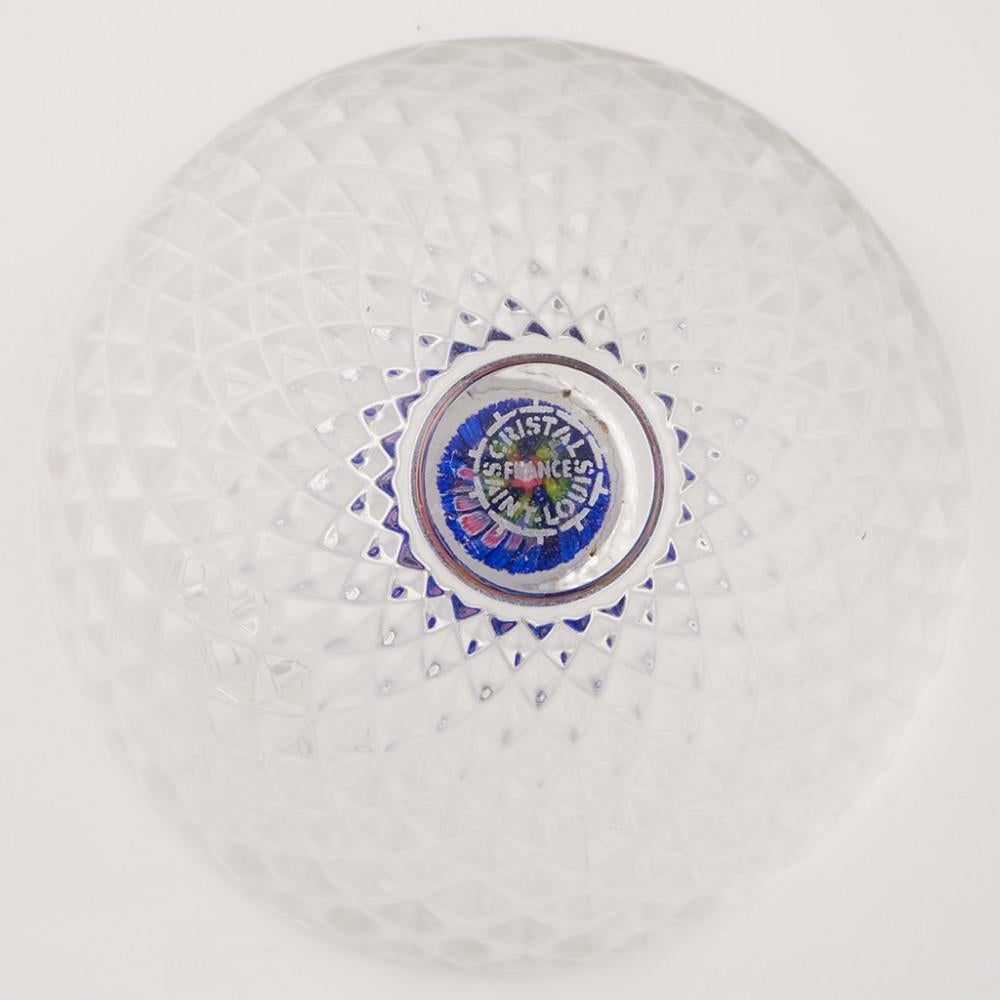 Heading : Saint Louis Millefiori Trinket Or Ring Dish
Date : c2000
Origin : France
Features : A large six row concentric millefiori cane within a clear glass moulded bowl
Marks : A Saint Louis label and etched mark to the base
Type : Lead
Size : 9cm