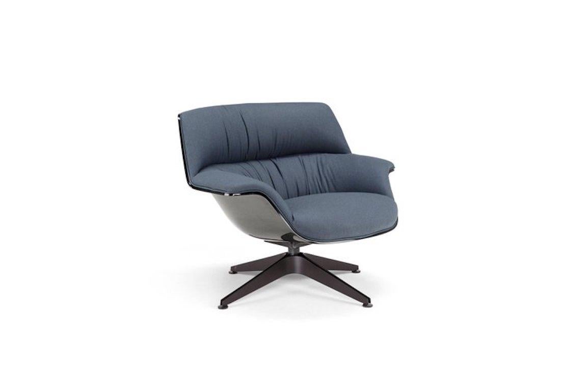 Coach is a comfortable and generous armchair, featuring soft and enveloping lines. The shell in linen composite embrace the seat and wide backrest, upholstered in leather or fabric to give the maximum comfort. The base is available in two options: a