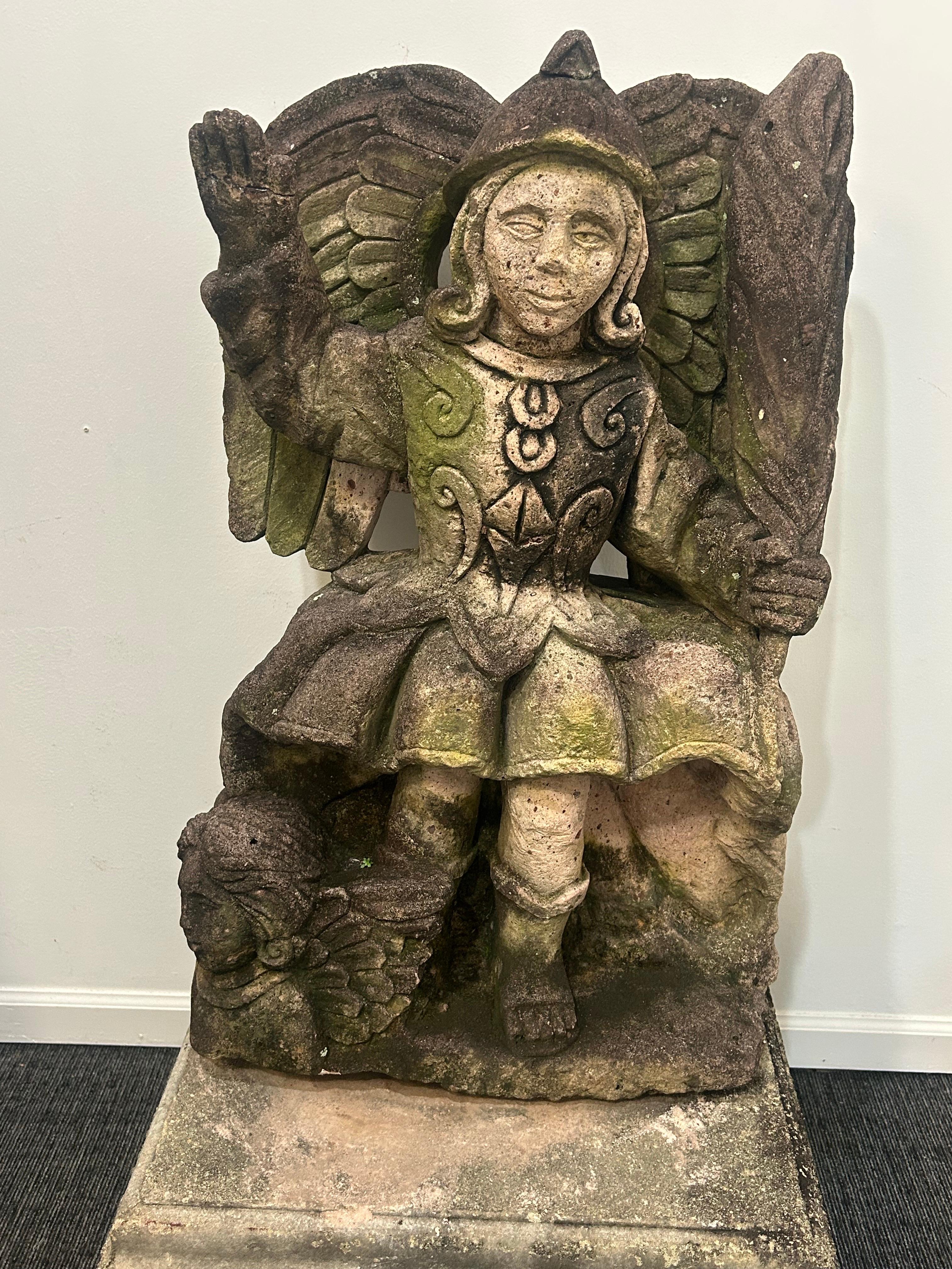 This seated  image of Saint Michael the Archangel has incredible detail, wonderful patina and a very peaceful presence .It is typical of late 19th and early 20th century Mexican sculpture. Very peaceful Saint Michael gazes forward with his right