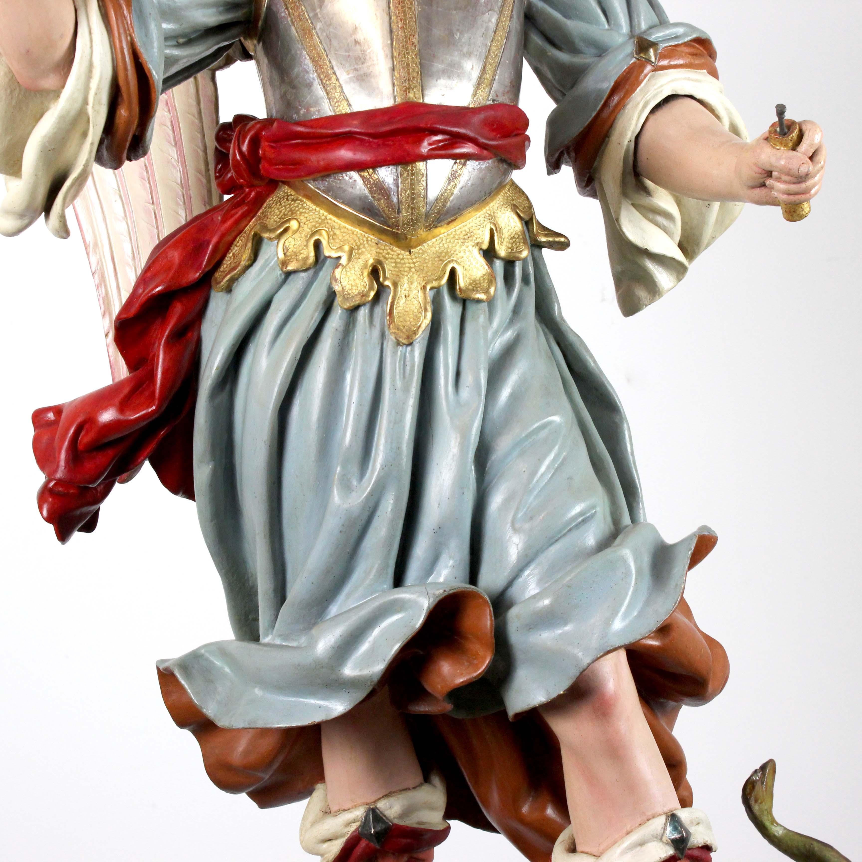 Painted Saint Michael the Archangel, polychrome carved wood, attributed to L.S. Carmona For Sale
