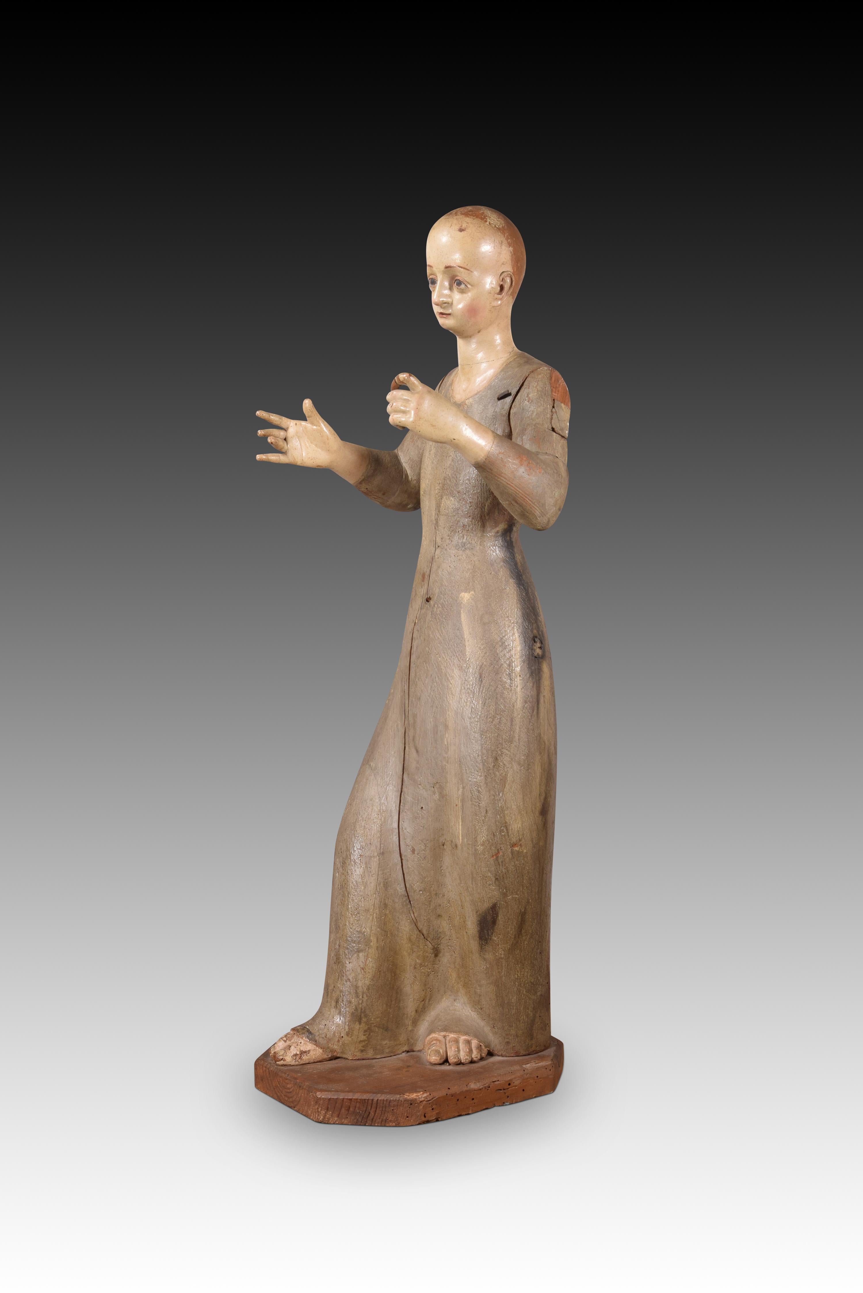 Saint or Virgin to dress. Wood, metal. Spanish school, 17th century.
 It has faults. 
The female figure stands (with her right leg forward) on a small polygonal base. Made of partially polychrome wood, note that the feet (which show through the