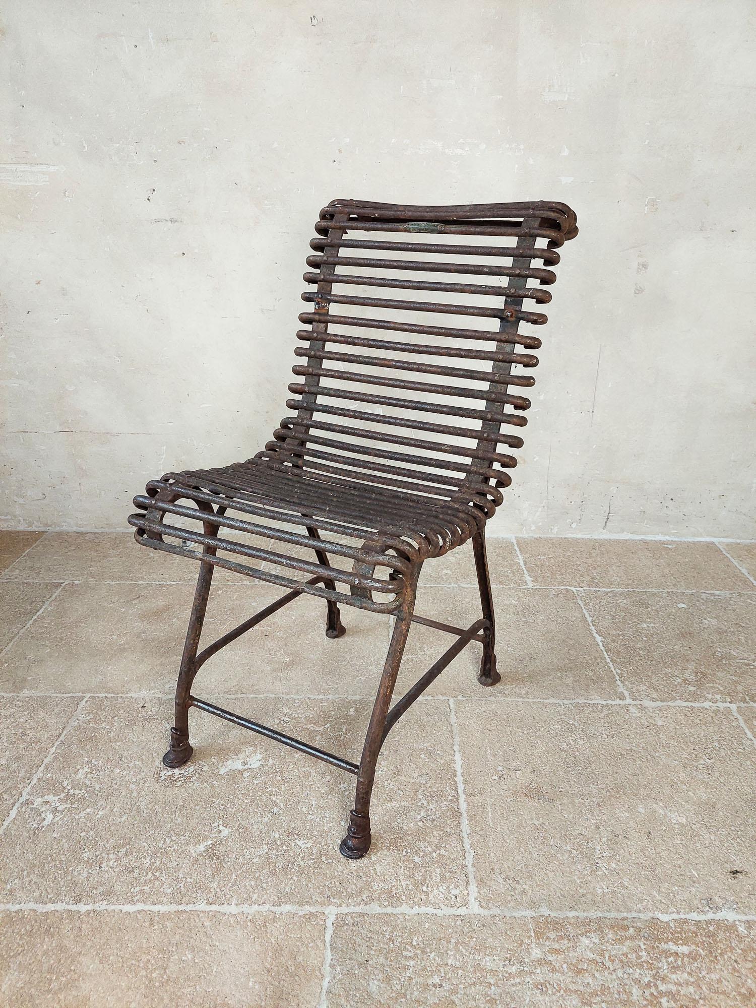 Saint Sauveur Garden Chair from Arras, 1910s. Marked. This garden chair made of wrought iron with cast iron feet. This chair has the characteristic horse hoof feet. Made in the factory in SAINT-SAUVEUR, located in Arras (France). These specialized