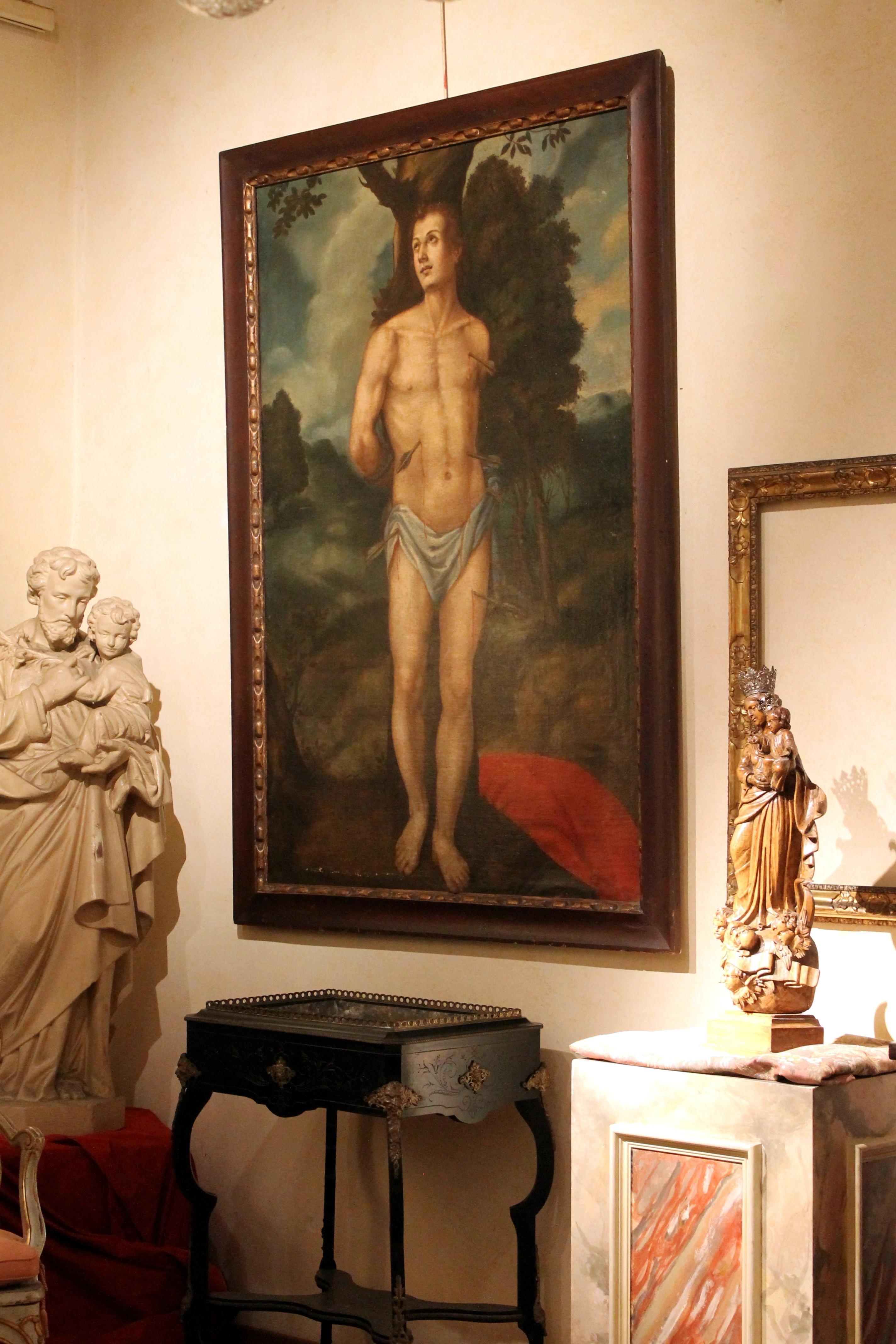 This antique Spanish School 17th century oil on canvas religious portait painting of Saint Sebastian is a symbol of rebirth and strength, so current and powerful that has become a gay icon and still contributes to redefine the perception of the