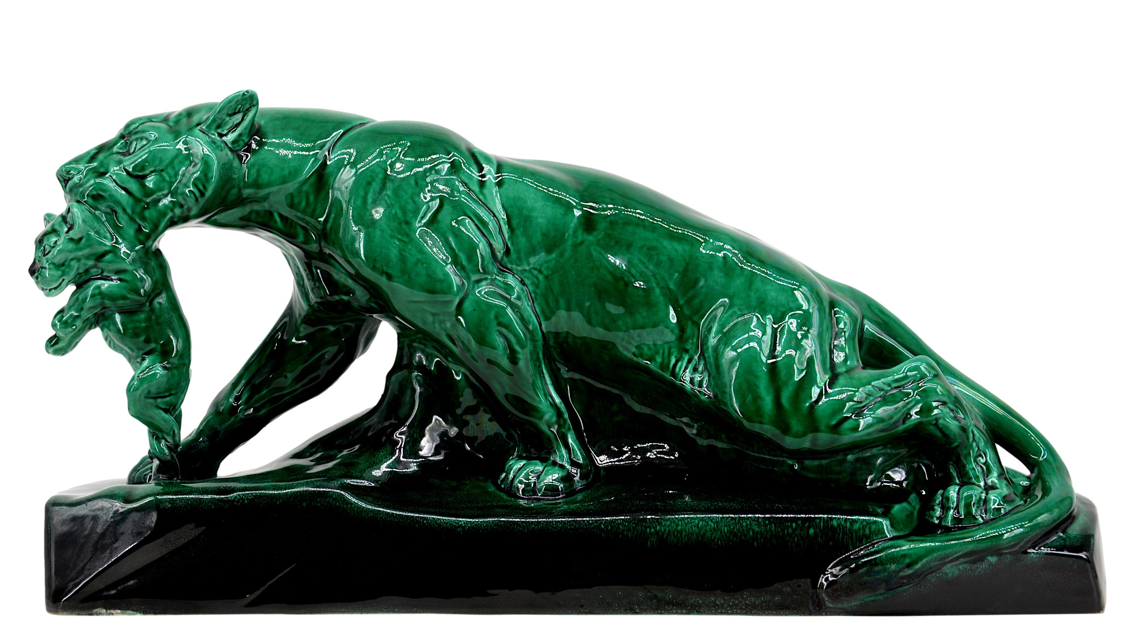 Large French Art Deco lioness sculpture by Sainte-Radegonde, France, 1930s. Glossy green ceramic. Lioness holding her lion cub in her mouth. Model named 