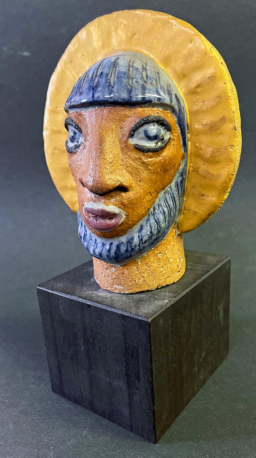This bold and penetrating portrait of a bearded saint with bluish hair and a golden halo was sculpted by Jais Nielsen, perhaps Denmark's greatest sculptor and ceramicist in the Art Deco era.  His exaggerated eyes and prominent beard show the