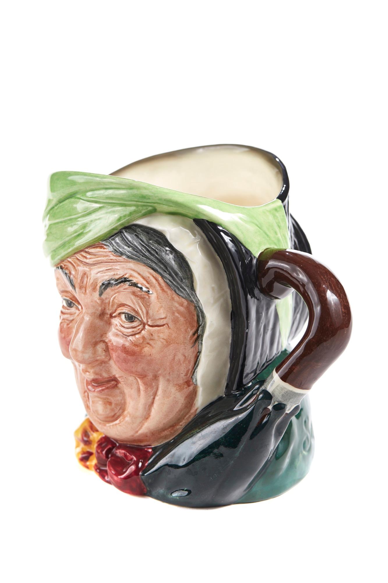 Offered for sale is this Sairey Gamp character Toby jug by Royal Doulton. 



  
