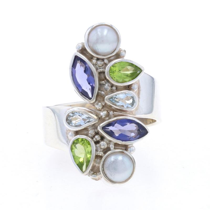 Size: 8 1/4

Brand: Sajen

Metal Content: Sterling Silver

Stone Information
Natural Pearls
Color: White

Natural Iolites
Cut: Marquise
Color: Purple

Natural Peridot
Cut: Pear
Color: Green

Natural Aquamarines
Treatment: Heating
Cut: Pear
Color: