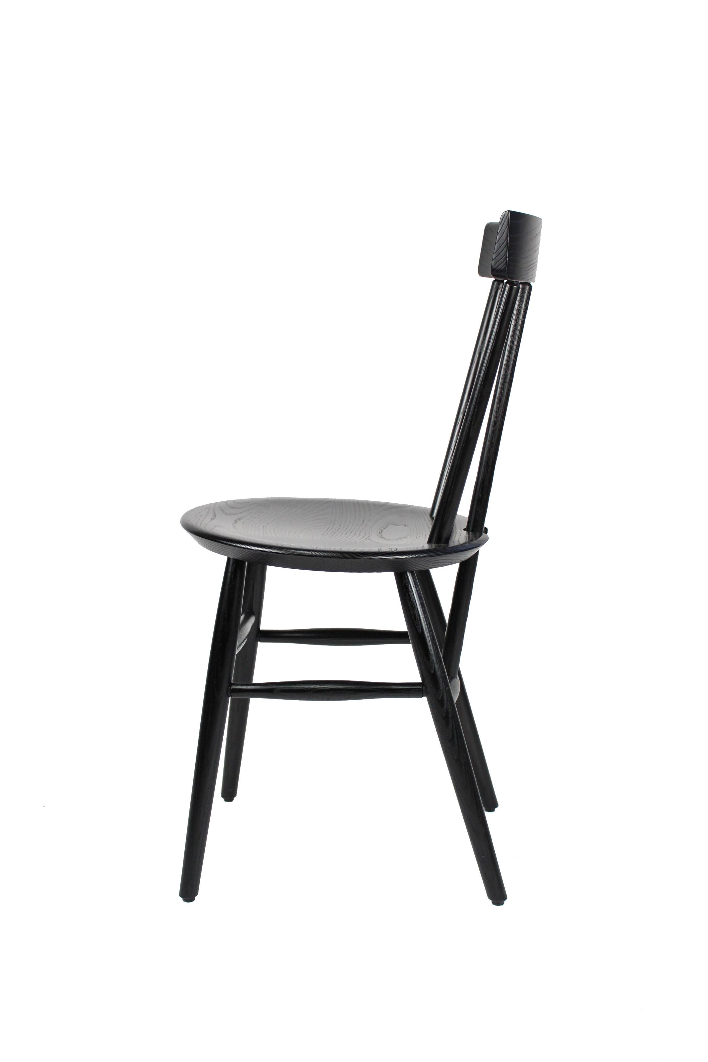 The Sakonnet café chair is a stylish Windsor chair perfect for small spaces and casual dining. Designed by Lothar Windels and developed through a collaboration with O&G, the Sakonnet echoes historic brace-back Windsor chairs with its unique
