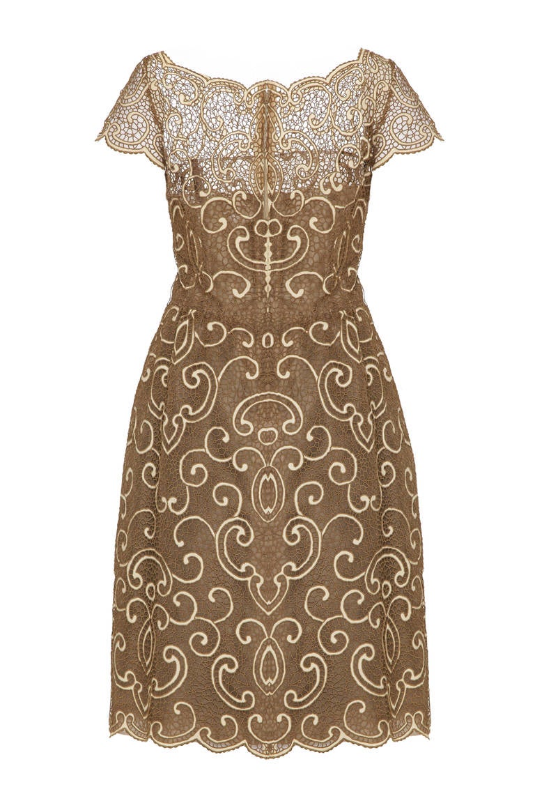 This exceptional 1960s pale gold and ivory lace dress is custom made by Roxanne for its Pret A Porter diffusion line Samuel Winston for sale at Saks 5th Avenue. This magnificent piece is of excellent quality and beautifully constructed, lined fully