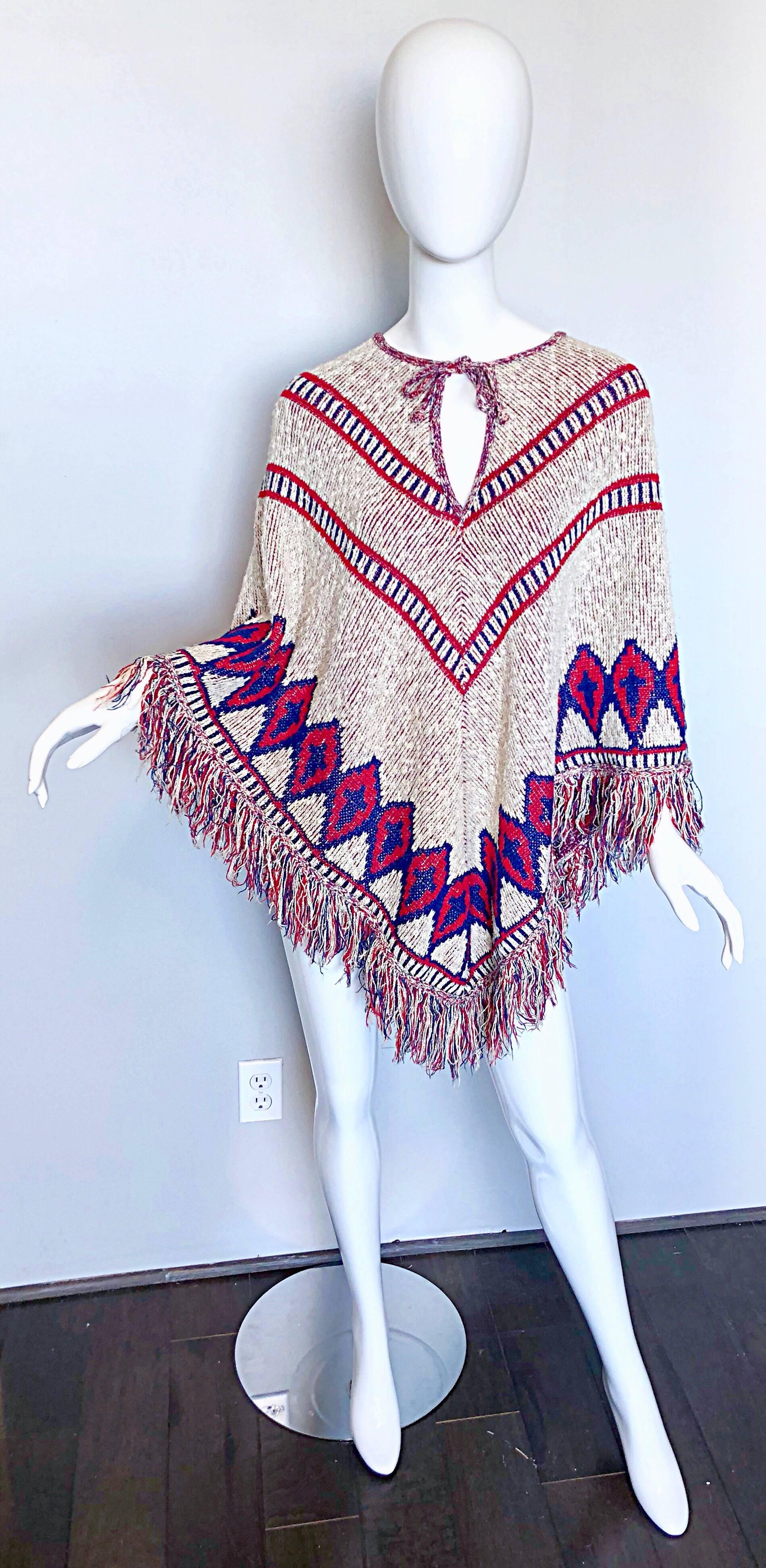 Incredible vintage 70s SAKS FIFTH AVE red, white and blue cotton knit hand-woven boho poncho cape! Features a Navajo inspired ethnic print throughout. Simply slips over the head--no armholes, so this is both easy to wear and super comfortable! Great