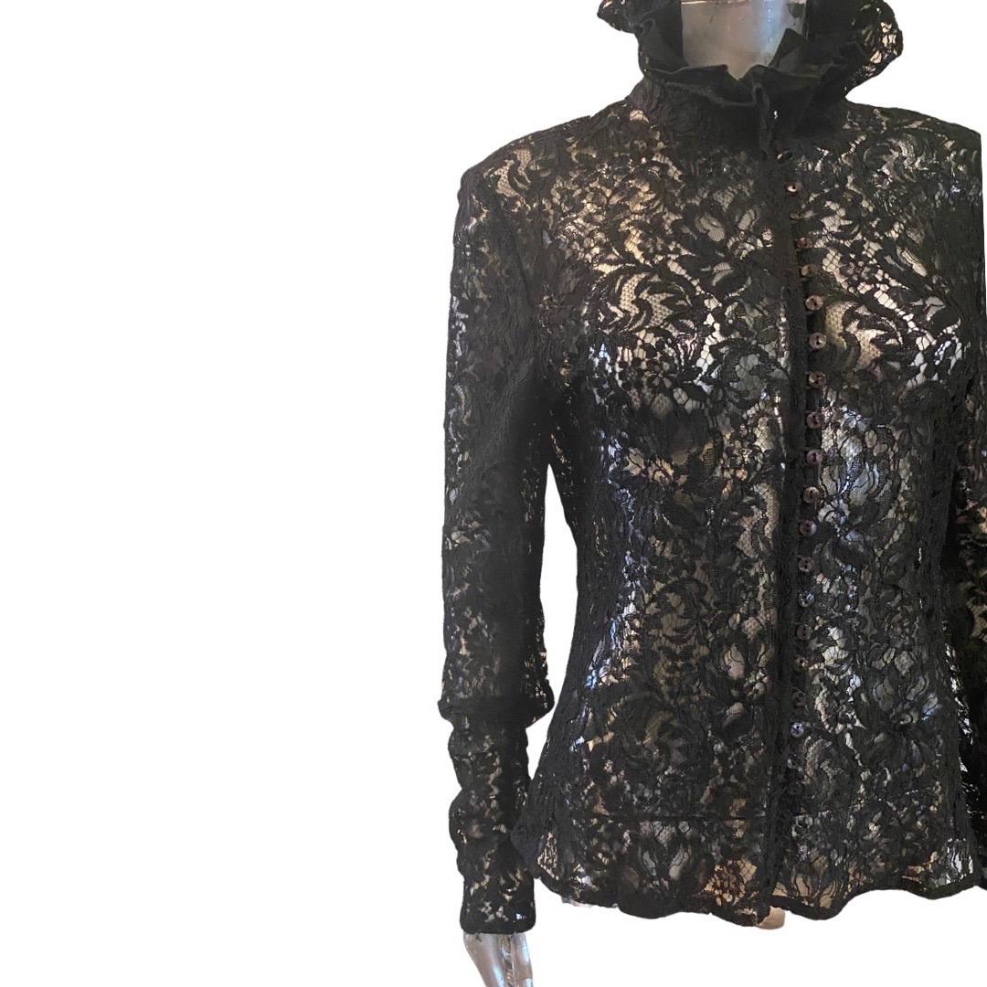 This gorgeous blouse was made by Saks Fifth Avenue. The black imported lace has a intricate floral design. The ruffle collar is made of pleated lace and another layer of black organza. This chic blouse has 24 mini mother of pearl buttons and