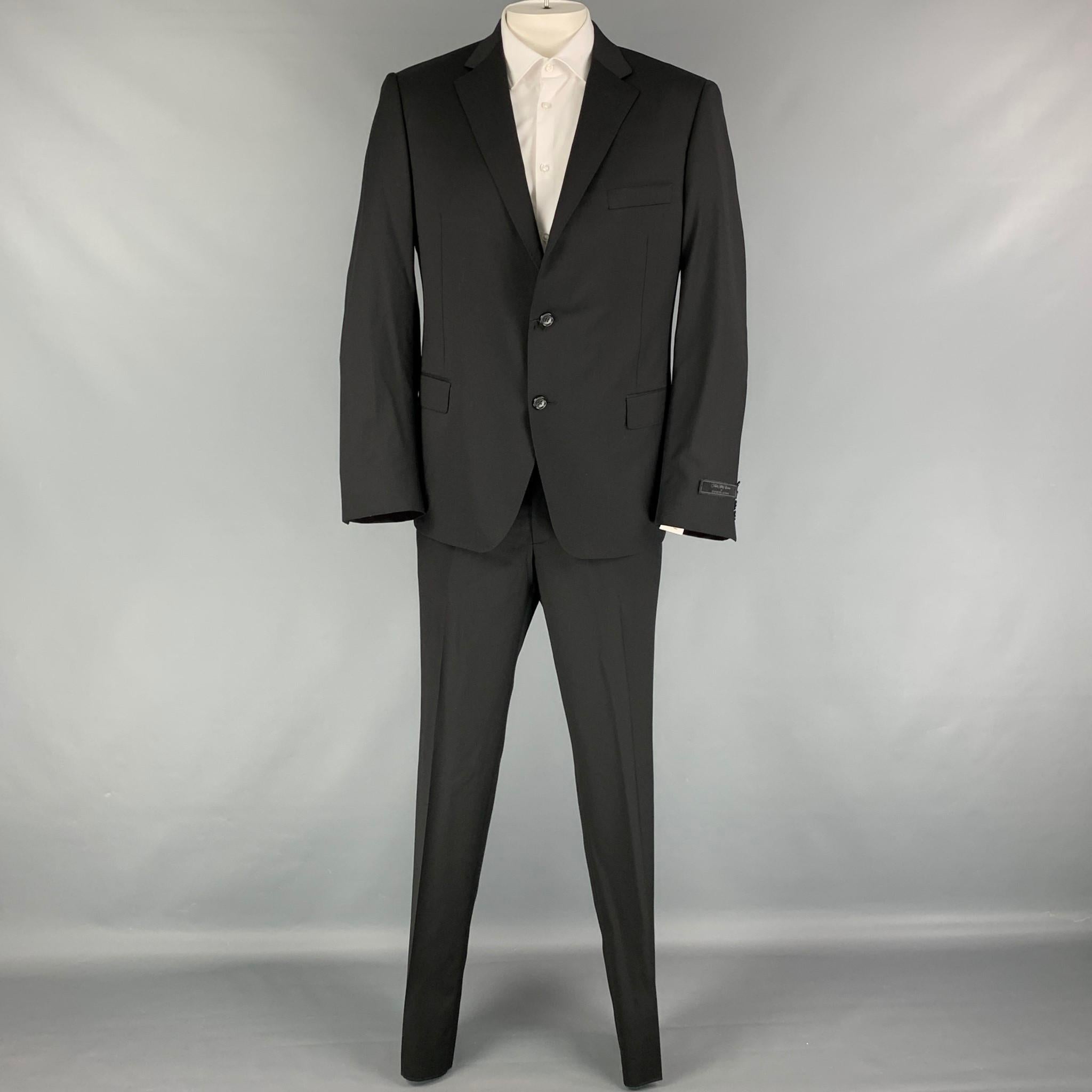 KS FIFTH AVENUE for SAMUELSOHN suit comes in a black wool with a full liner and includes a single breasted, double button sport coat with a notch lapel and matching flat front trousers. Made in Canada.

New With Tags.
Marked: 44-38 R
Original Retail