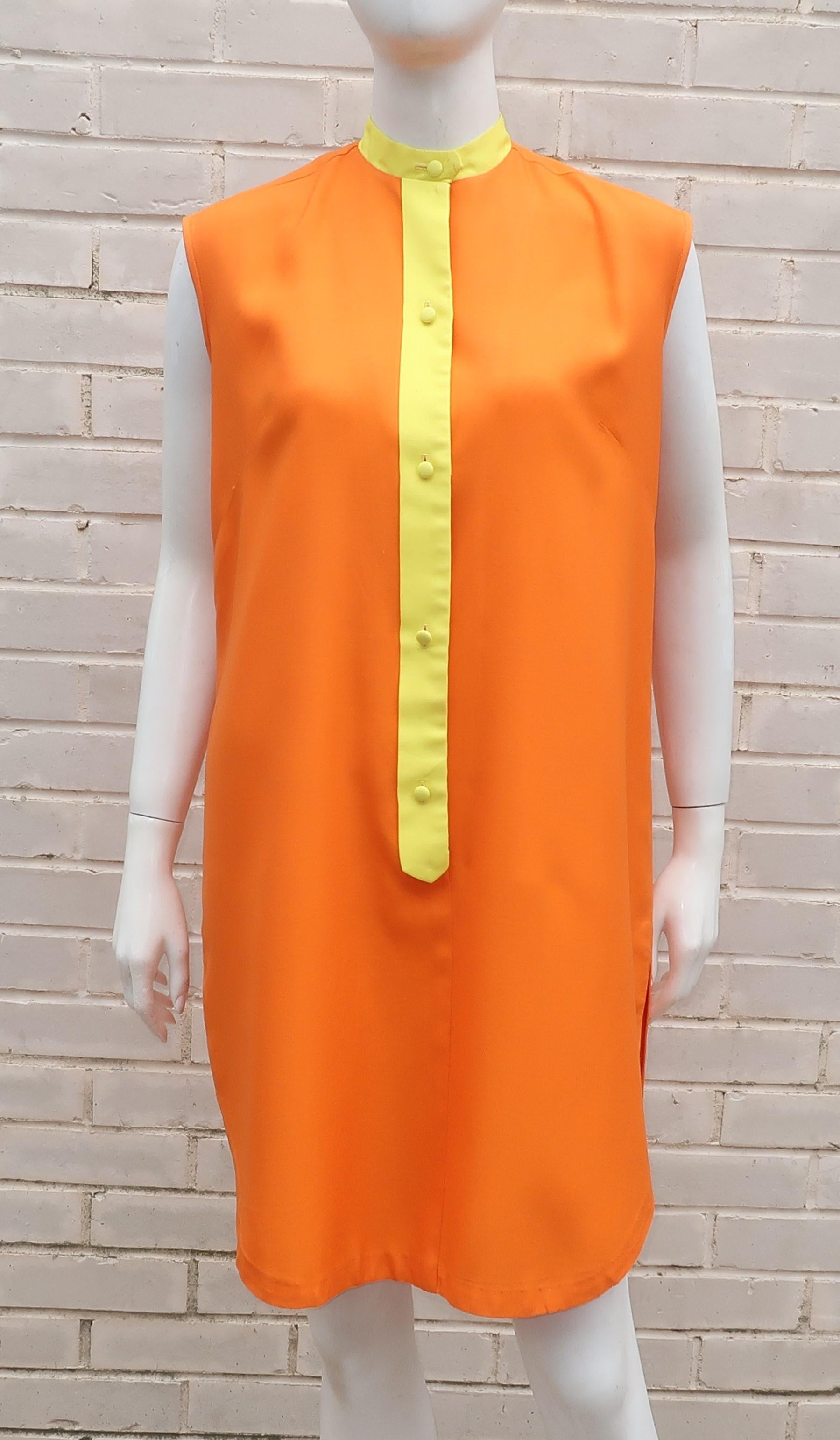 Saks Fifth Avenue bright orange cotton blend shift dress with a yellow Mandarin style neckline which buttons down the front.  The sleeveless silhouette and side vents provide a casual look that is perfect for easy Summertime fashions.
CONDITION
Good
