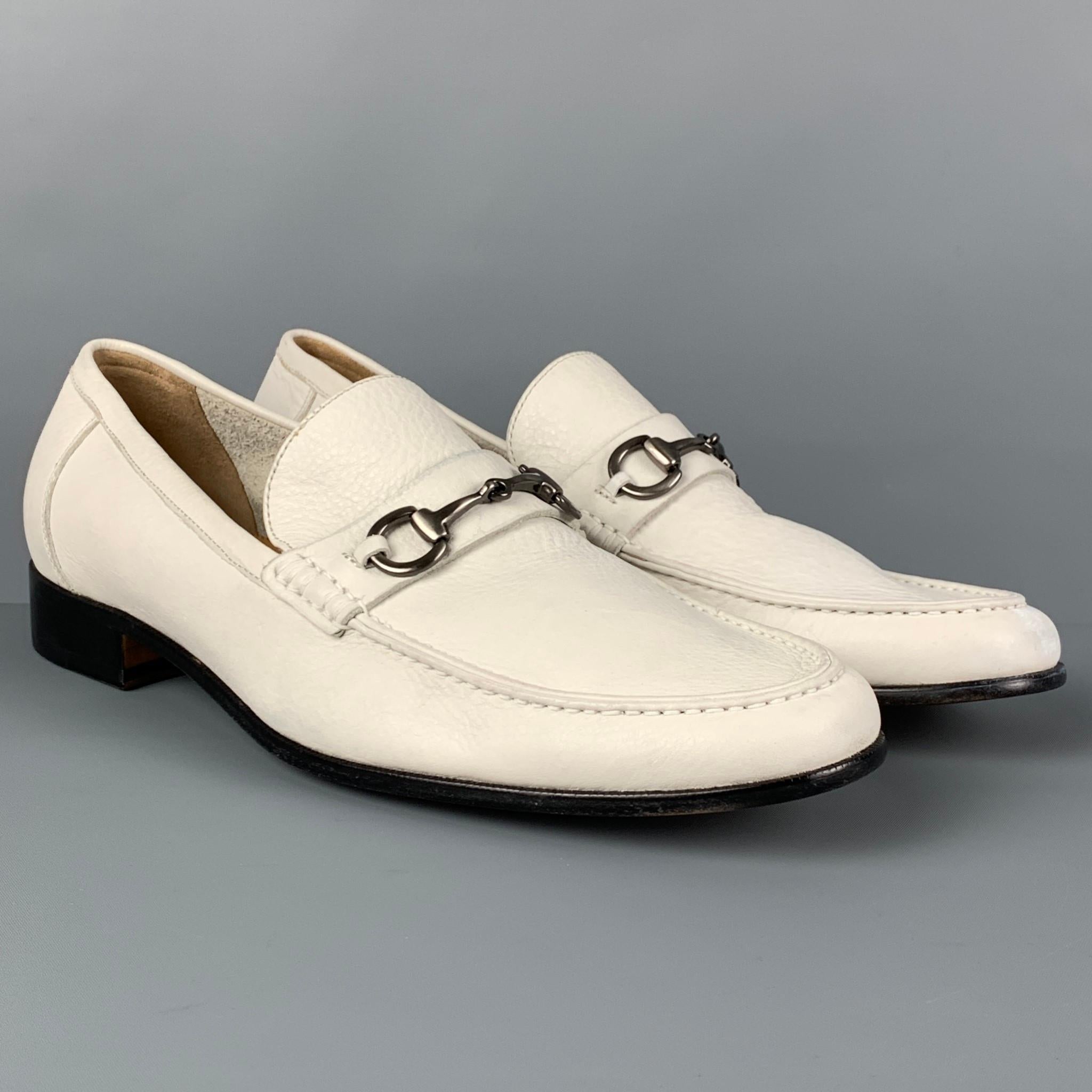 SAKS FIFTH AVENUE loafers comes in a white leather featuring a horse bit detail and a slip on style. 

Very Good Pre-Owned Condition.
Marked: 11

Outsole: 12.5 in. x 4 in. 
