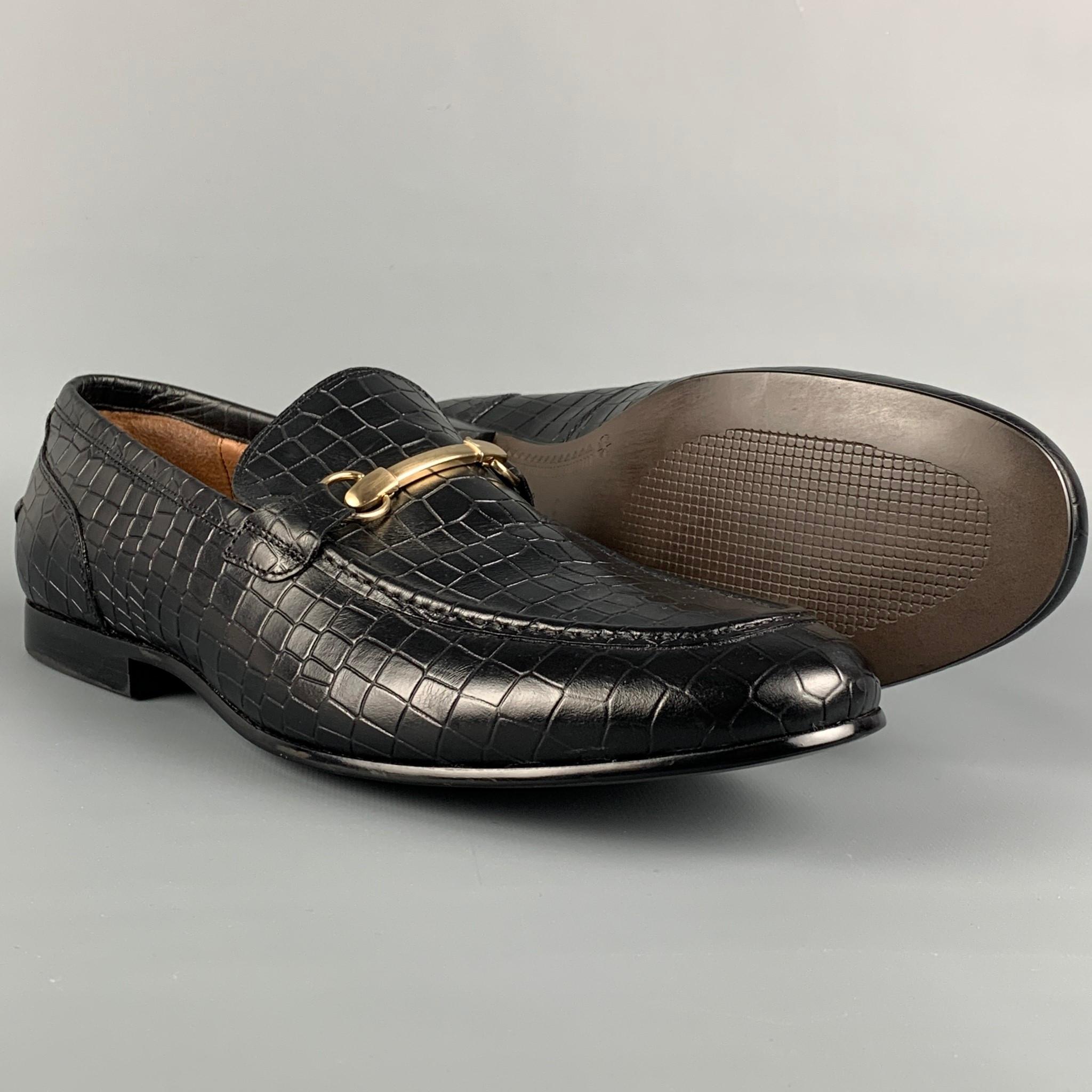 SAKS FIFTH AVENUE loafers comes in a black embossed leather featuring a gold tone horsebit detail and a slip on style. 

Very Good Pre-Owned Condition.
Marked: 12 M

Outsole: 12.25 in. x 4 in. 