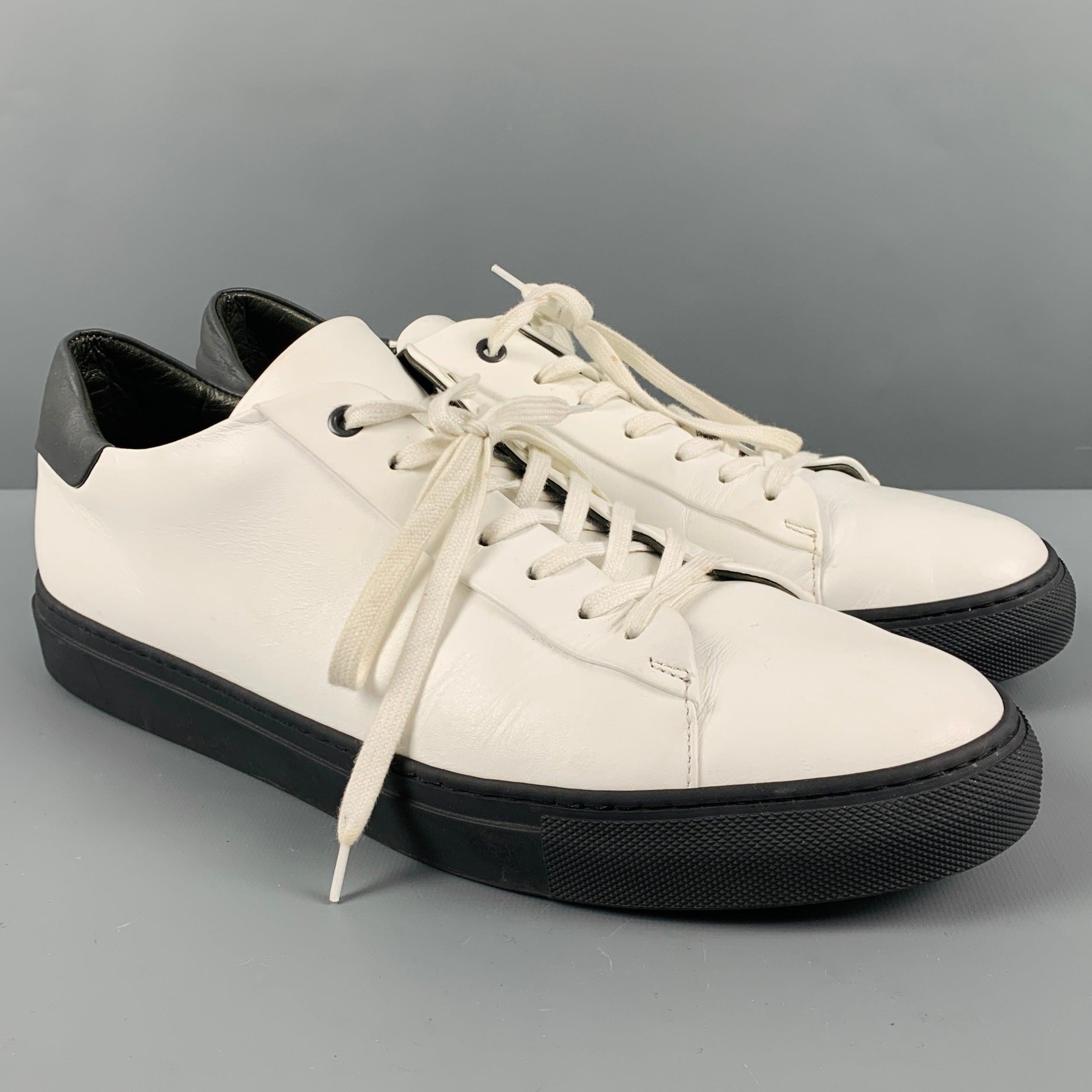 SAKS FIFTH AVENUE lace-up shoes
in a white leather fabric featuring black leather trim, low top style, and black rubber sole. Made in Italy.Excellent Pre-Owned Condition. 

Marked:   11852 07 12Outsole: 12.5 inches  x 4.25 inches 
  
  
 
Reference