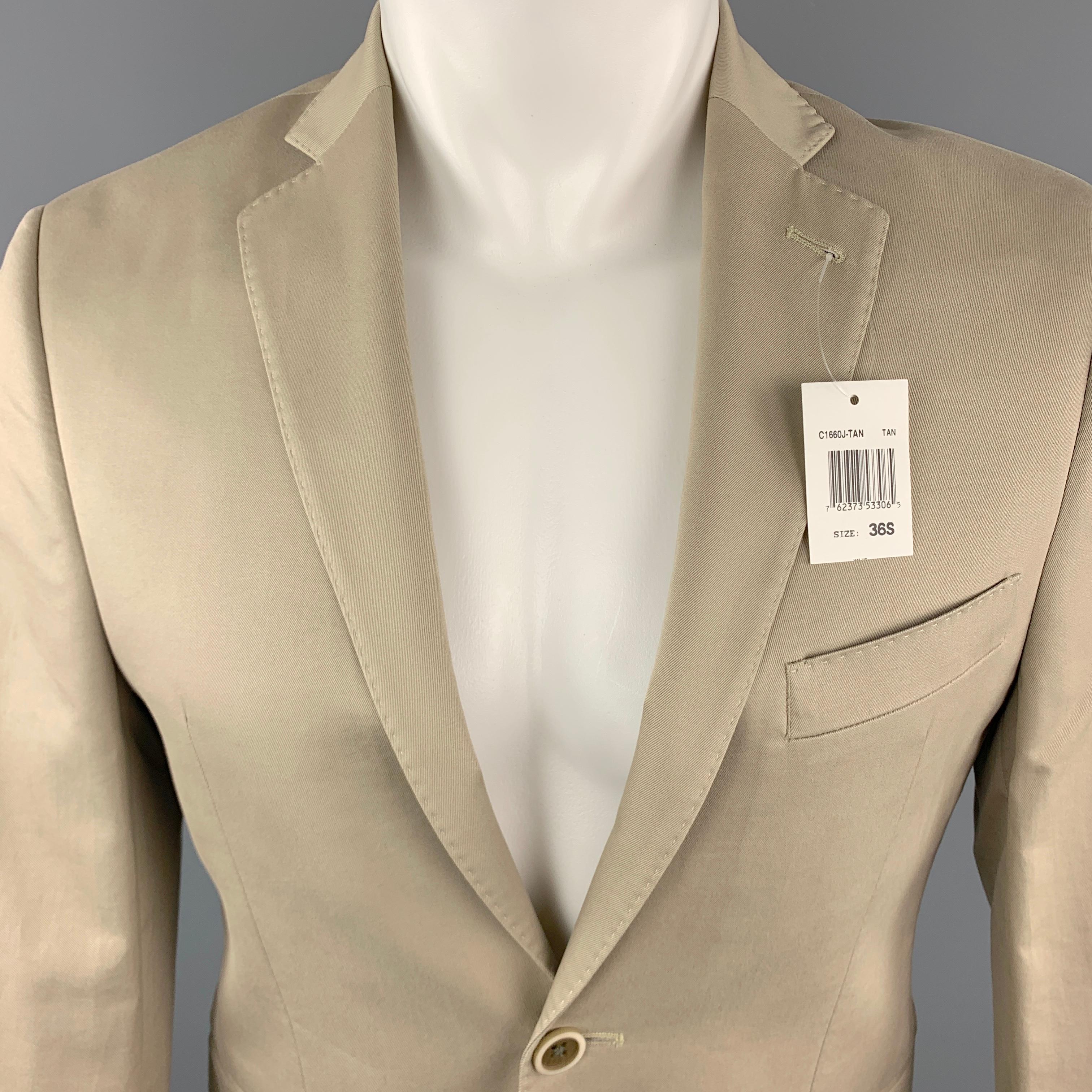 SAKS FIFTH AVENUE Sport Coat Jacket comes in a khaki tone in a solid cotton material, with a notch lapel, slit pockets, two buttons at closure, single breasted, buttoned cuffs, internal pockets, a double vent at back, unlined.  

New with