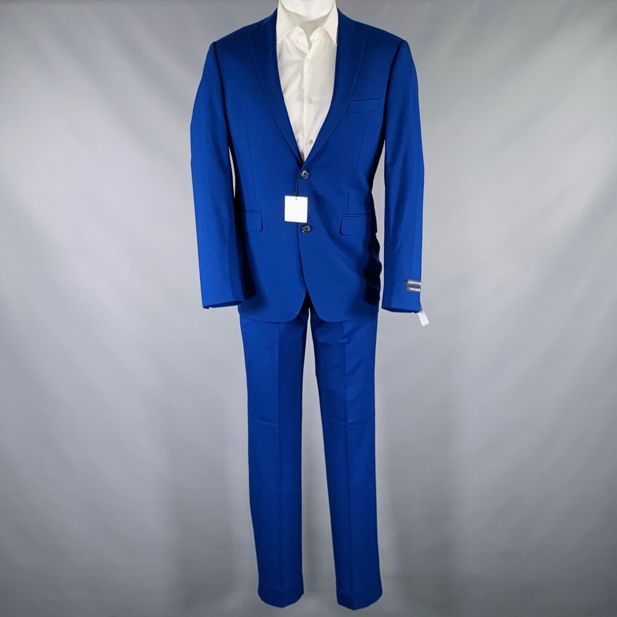 SAKS FIFTH AVENUE suit in a royal blue wool with a full liner and includes a single breasted, double button sport coat with a notch lapel and matching flat front trousers. Made in Italy.New with Tags. 

Marked:   38R 

Measurements: 
 