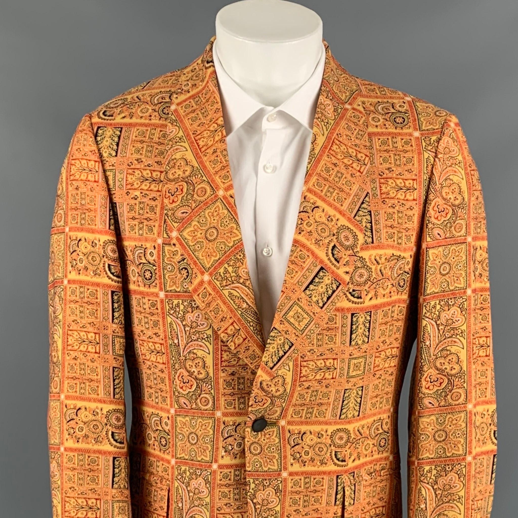 SAKS FIFTH AVENUE sport coat comes in a gold & red print wool blend with a full liner featuring a shawl collar, single back vent, flap pockets, and a single button closure. Made in USA.

Very Good Pre-Owned Condition.
Marked: No size