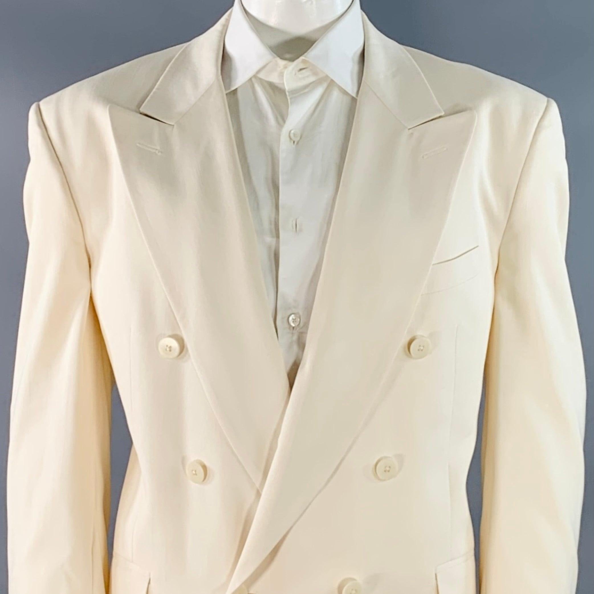 SAKS FIFTH AVENUE sport coat
in a cream silk shantung fabric featuring a double breasted style, peak lapel, ventless back, and single button closure. Made in USA.Very Good Pre-Owned Condition. Multiple minor marks and signs of wear. 

Marked:   size