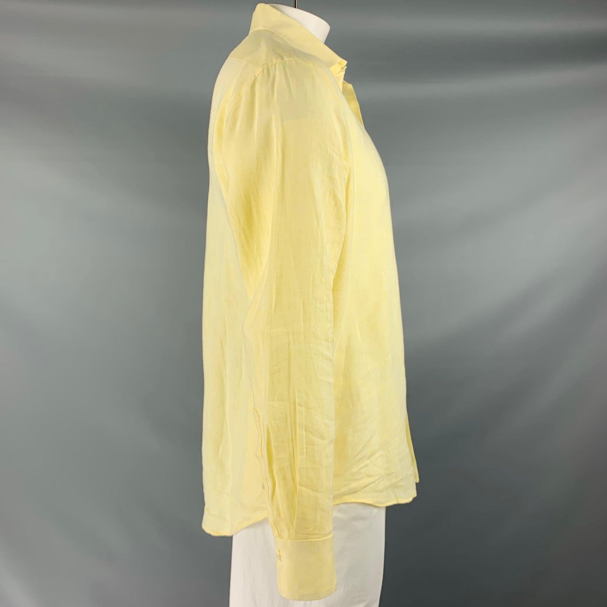 SAKS FIFTH AVENUE long sleeve shirt
in a yellow linen woven fabric featuring spread collar, one pocket, and button closure.Very Good Pre-Owned Condition. Minor signs of wear. 

Marked:   L 

Measurements: 
 
Shoulder: 17 inches Chest: 46 inches